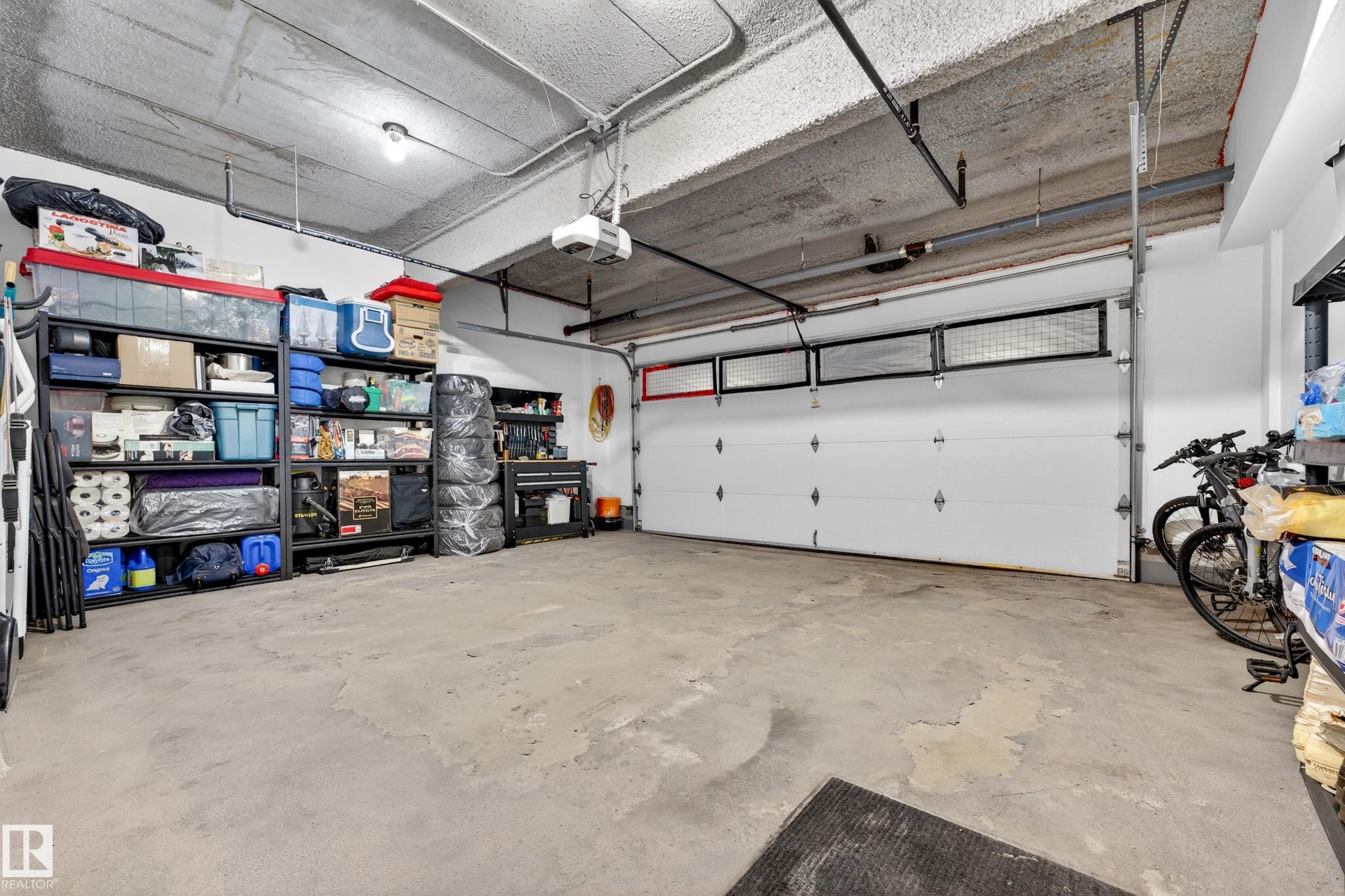 109 5151 Windermere Boulevard, Edmonton, AB - Indoor Photo Showing Garage