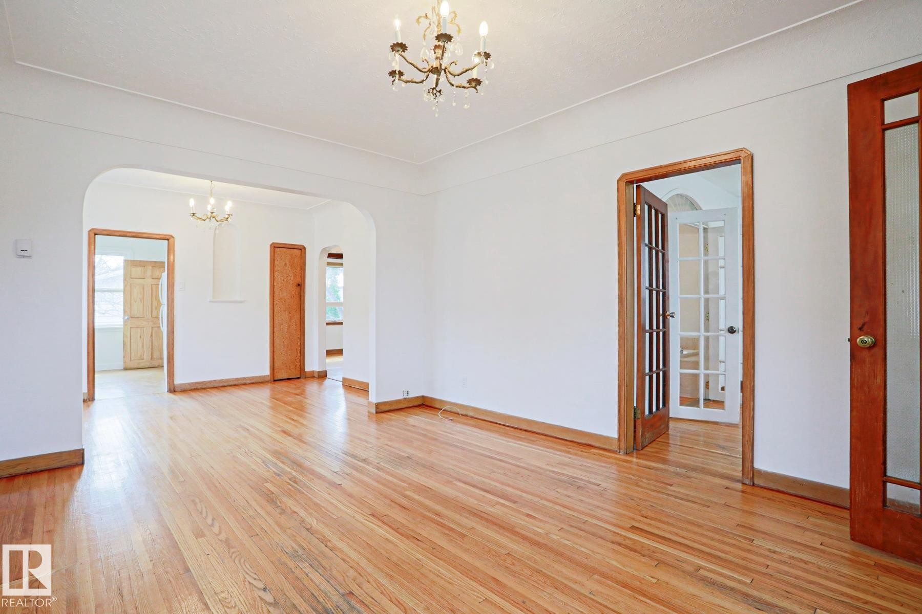 Hardwood flooring extending throughout the space - 9611 81 Avenue, Edmonton, AB - Indoor Photo Showing Other Room