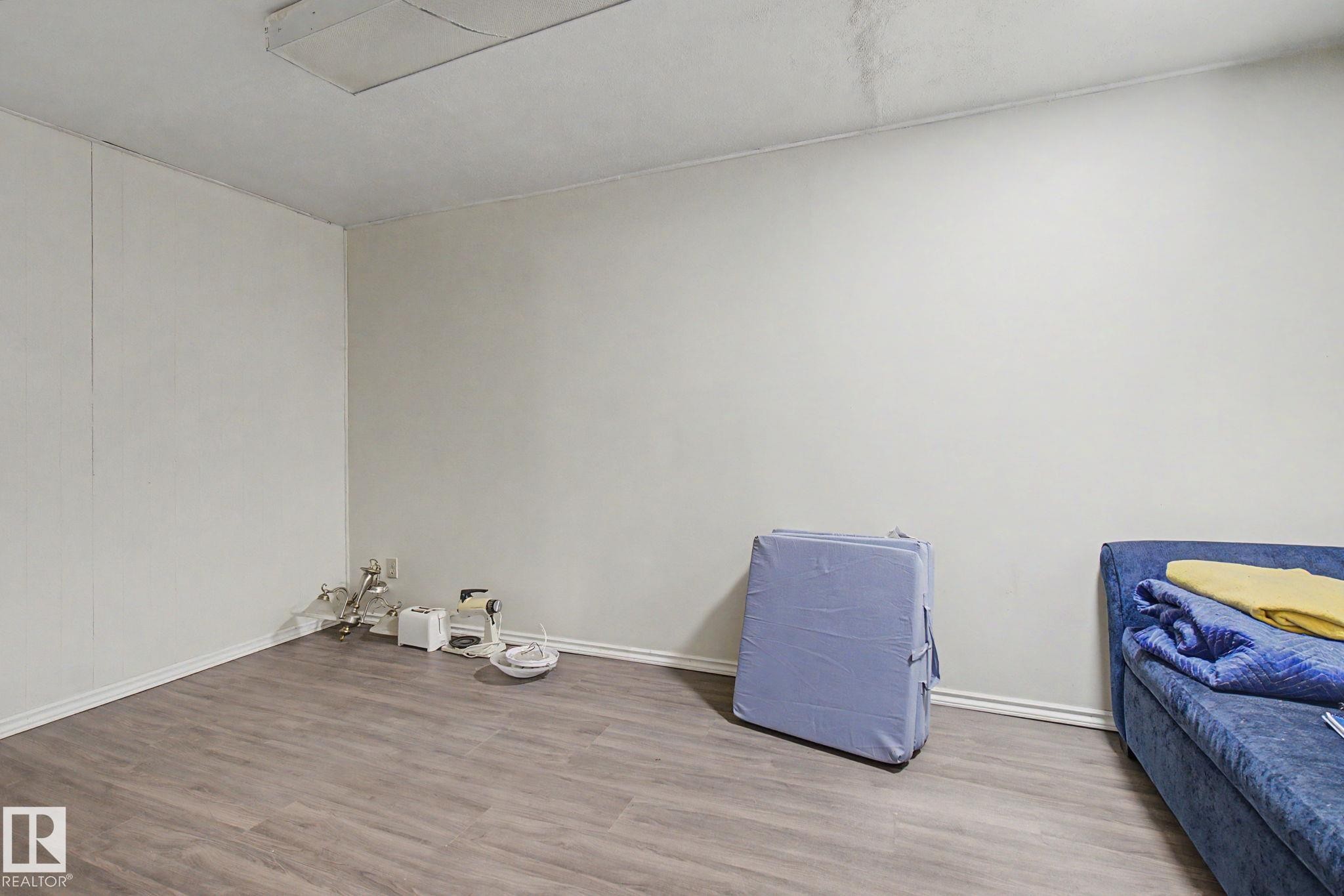 Neutral-toned walls complement wood-finish flooring - 4106 38 Street, Edmonton, AB - Indoor