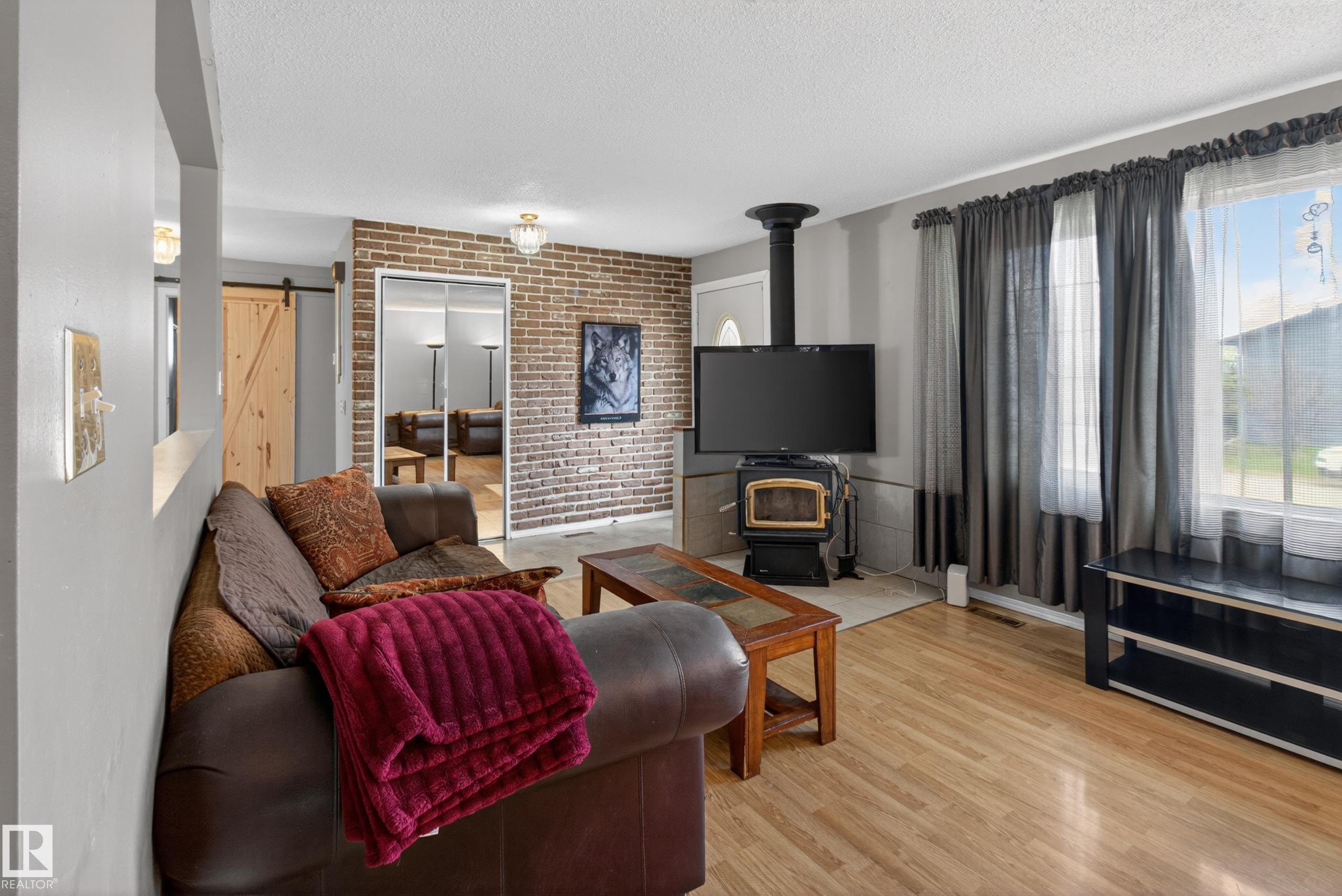 47 Duke Drive, Lamont, AB - Indoor Photo Showing Living Room With Fireplace