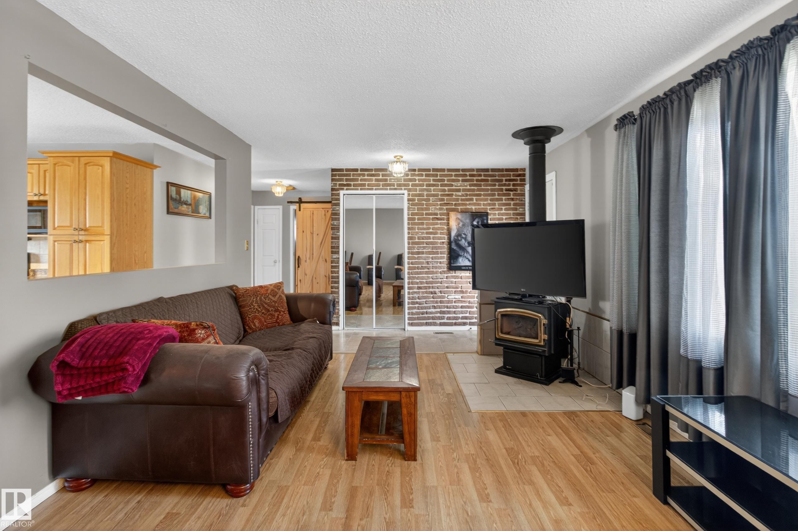 47 Duke Drive, Lamont, AB - Indoor Photo Showing Living Room With Fireplace