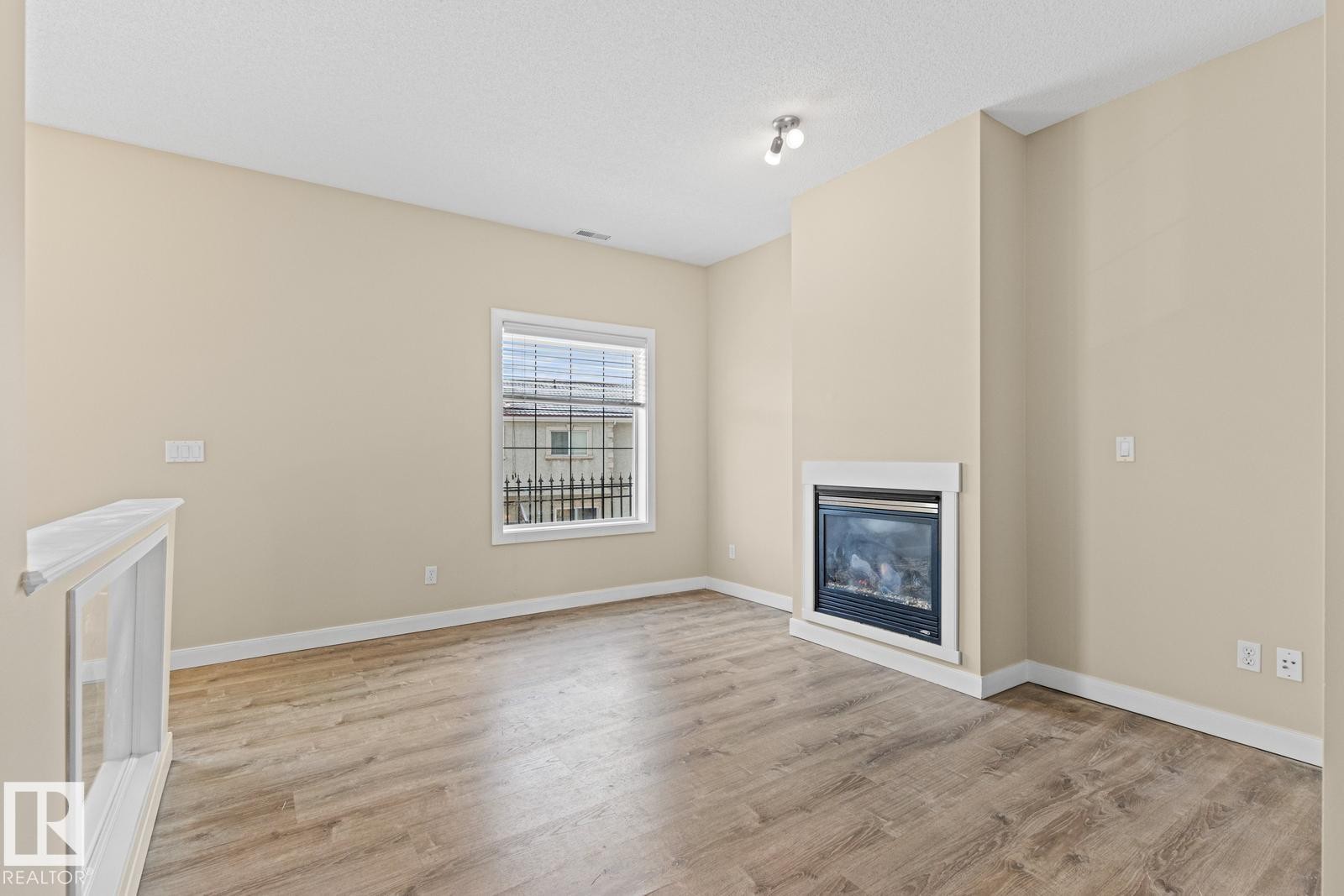 39 13825 155 Avenue, Edmonton, AB - Indoor Photo Showing Other Room With Fireplace