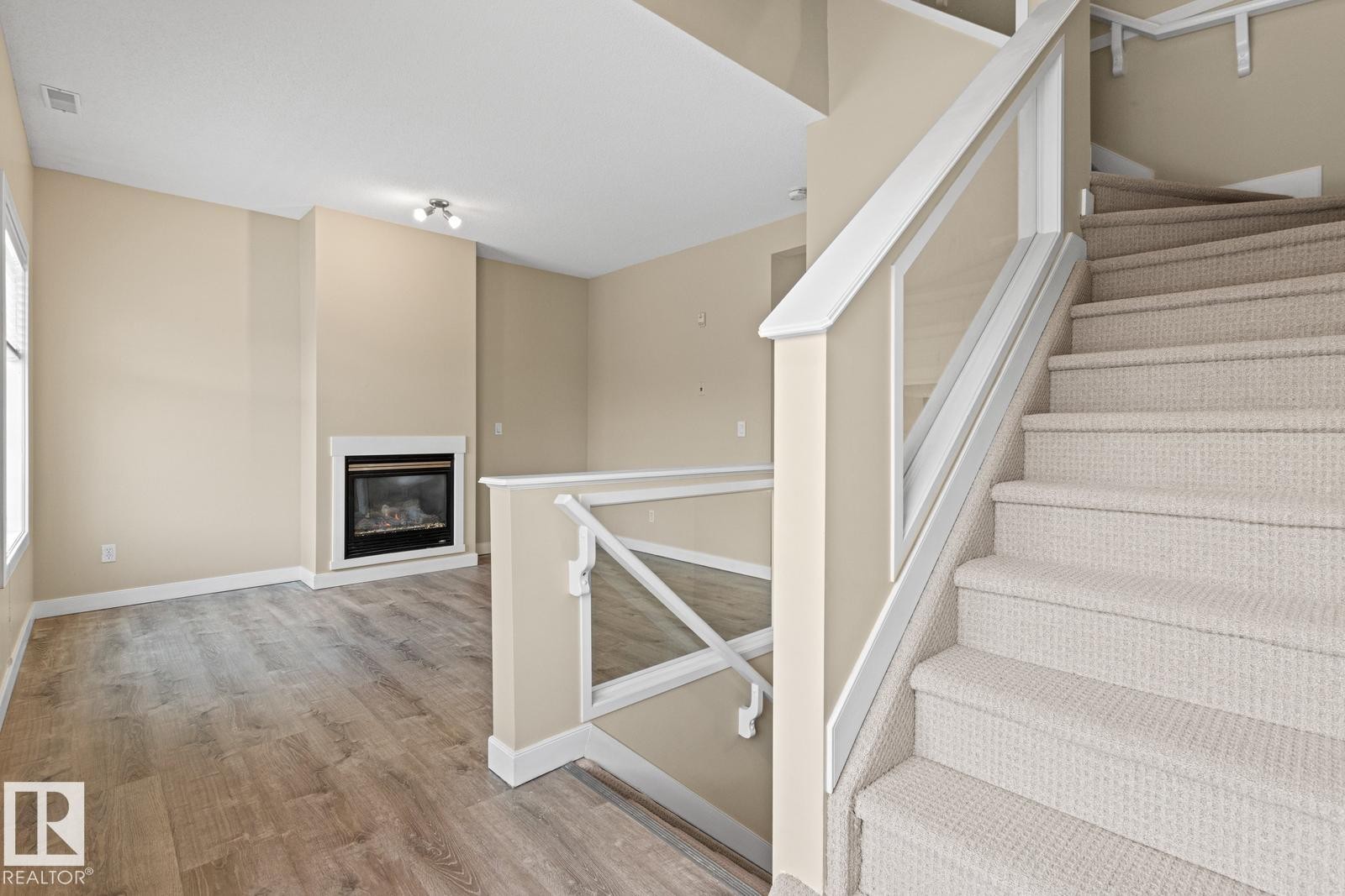 39 13825 155 Avenue, Edmonton, AB - Indoor Photo Showing Other Room With Fireplace