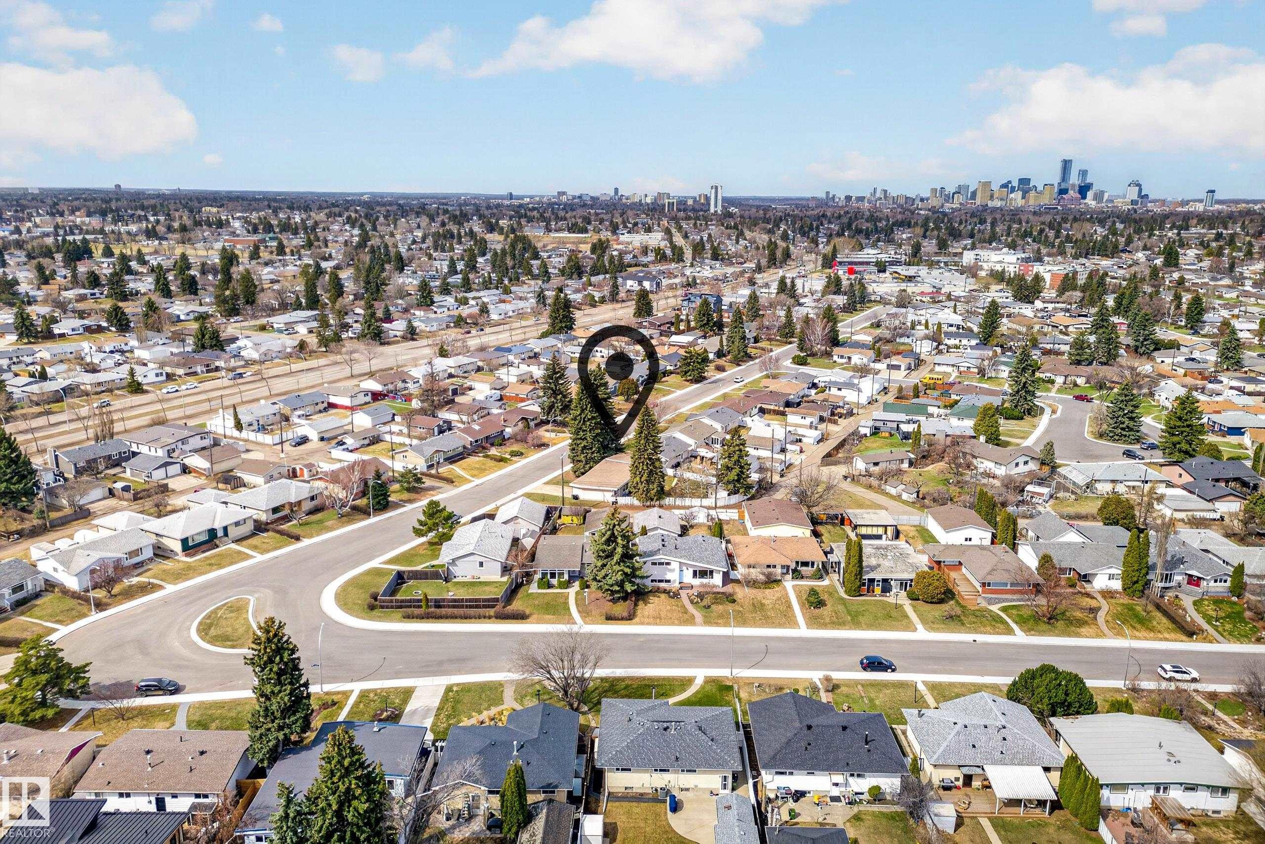 Aerial perspective of a residential neighborhood featuring numerous detached homes with varied rooflines and surrounding green spaces - 5304 90A Avenue, Edmonton, AB - Outdoor With View