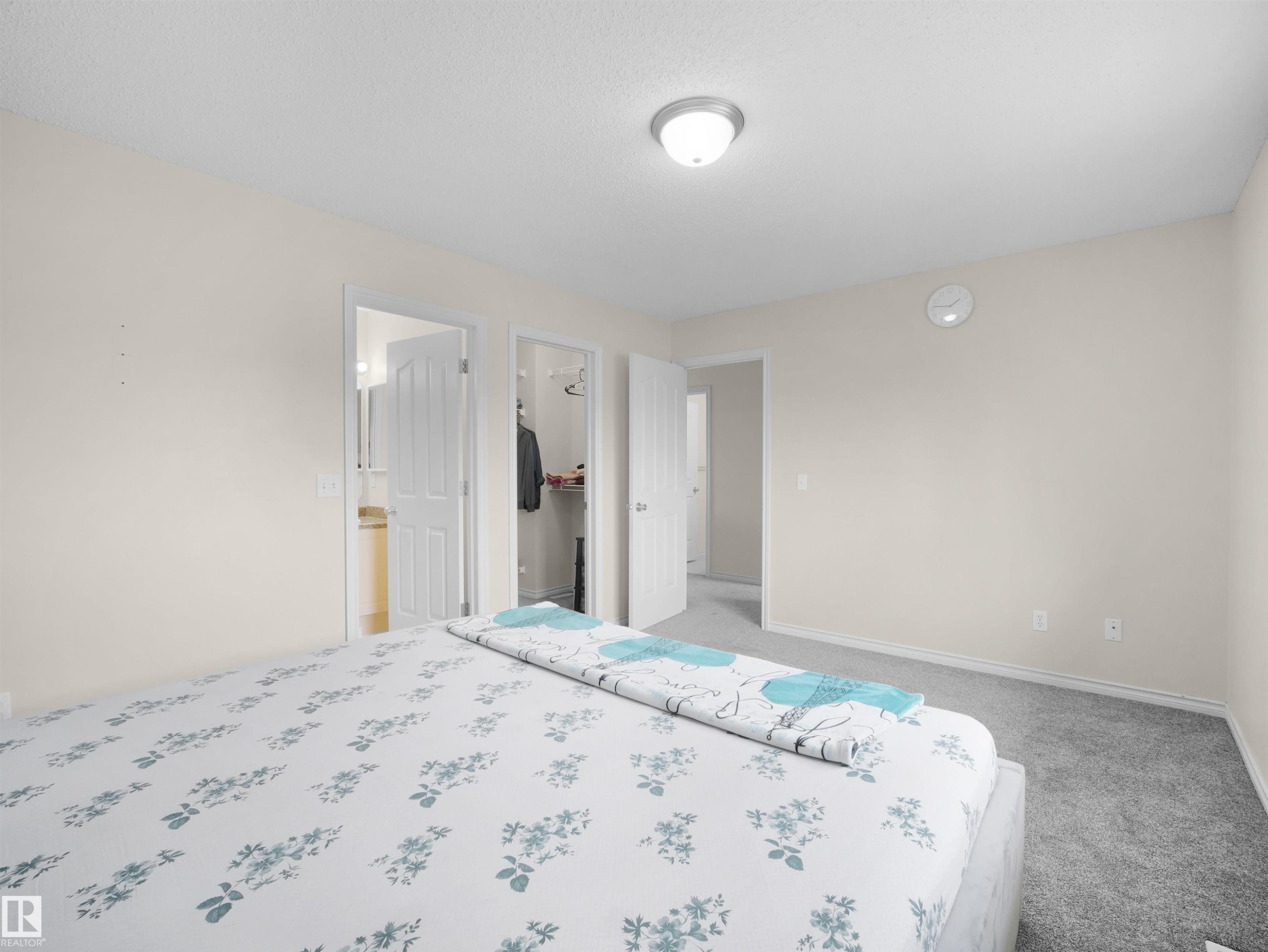 Carpeted room with neutral wall tones and white trim - 7407 Singer Landing, Edmonton, AB - Indoor Photo Showing Bedroom