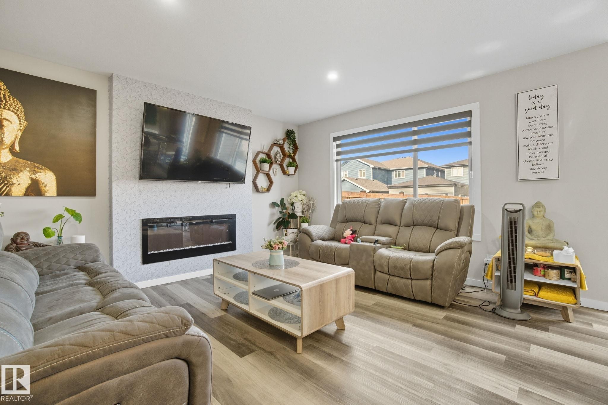 Living space featuring wood-finish flooring and recessed lighting - 2039 Wonnacott Way, Edmonton, AB