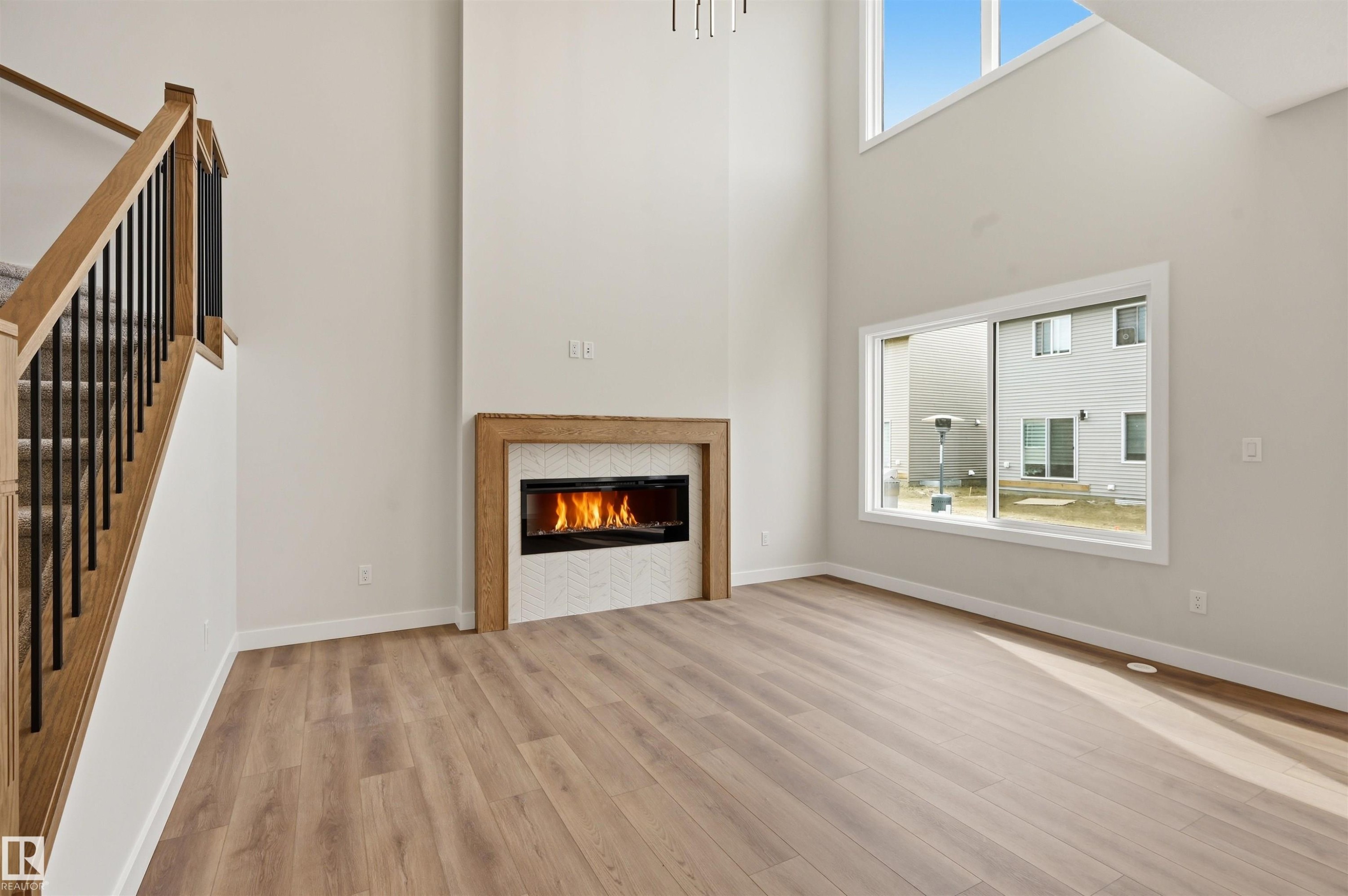 3218 Dixon Way, Edmonton, AB - Indoor Photo Showing Living Room With Fireplace