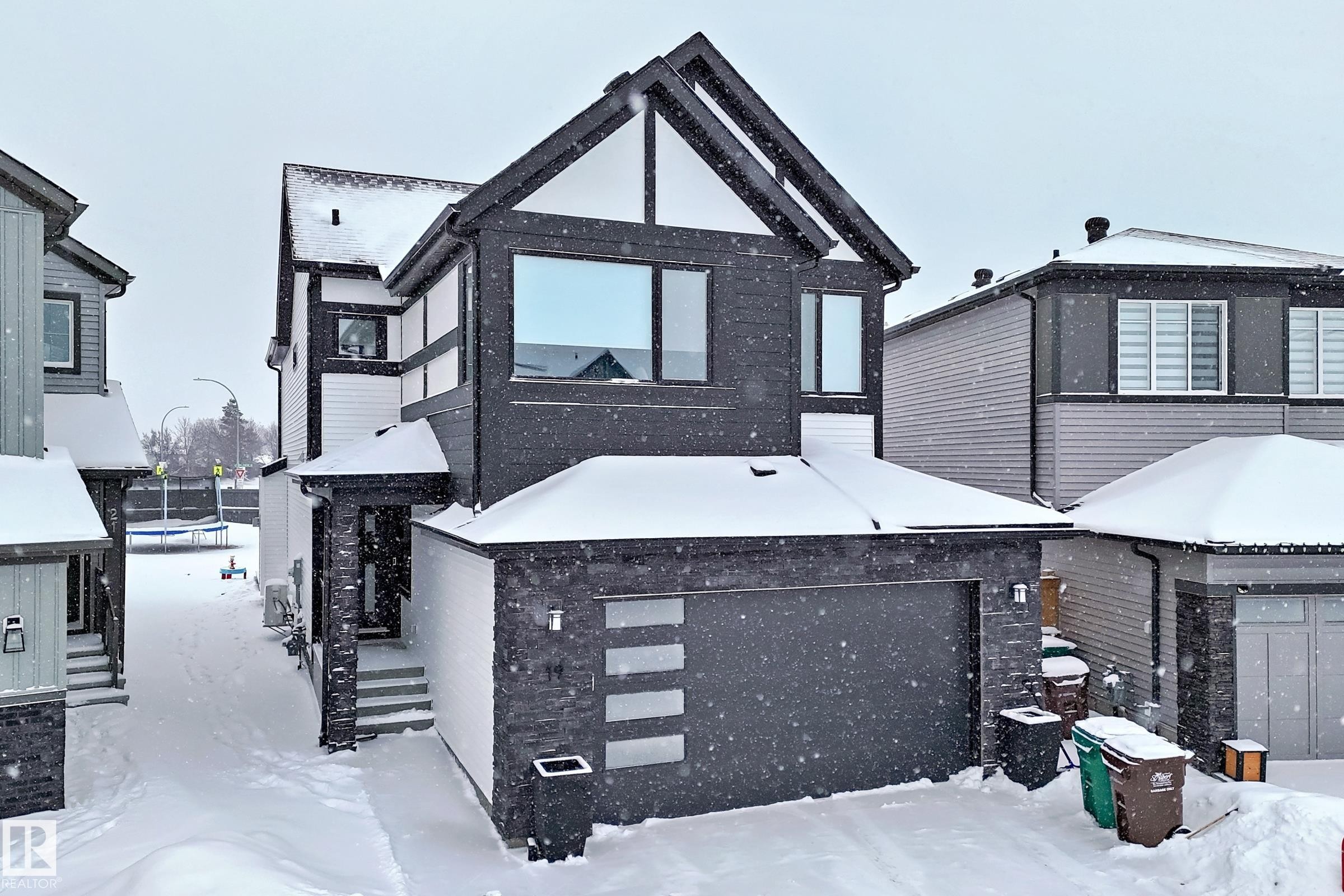 The property features a modern exterior with dark-toned siding and white trim accents - 19 Nettle Crescent, St. Albert, AB - Outdoor