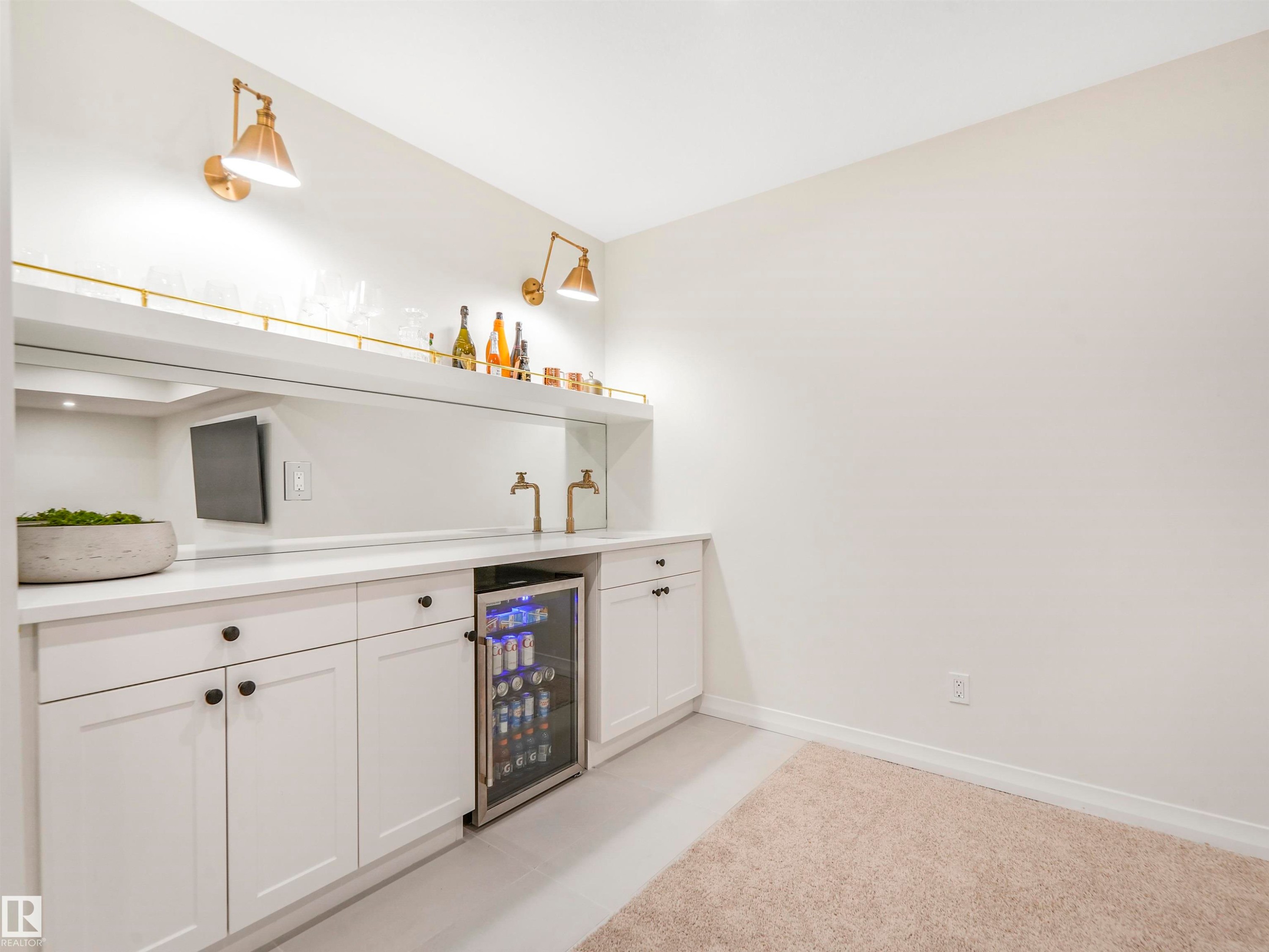 Wet bar area featuring white cabinetry, a built-in beverage refrigerator, and a mirrored backsplash - 19 Nettle Crescent, St. Albert, AB - Indoor