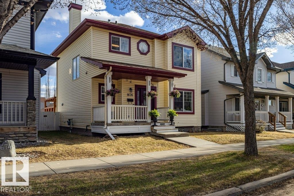 1676 Tomlinson Common, Edmonton, AB - Outdoor With Deck Patio Veranda With Facade