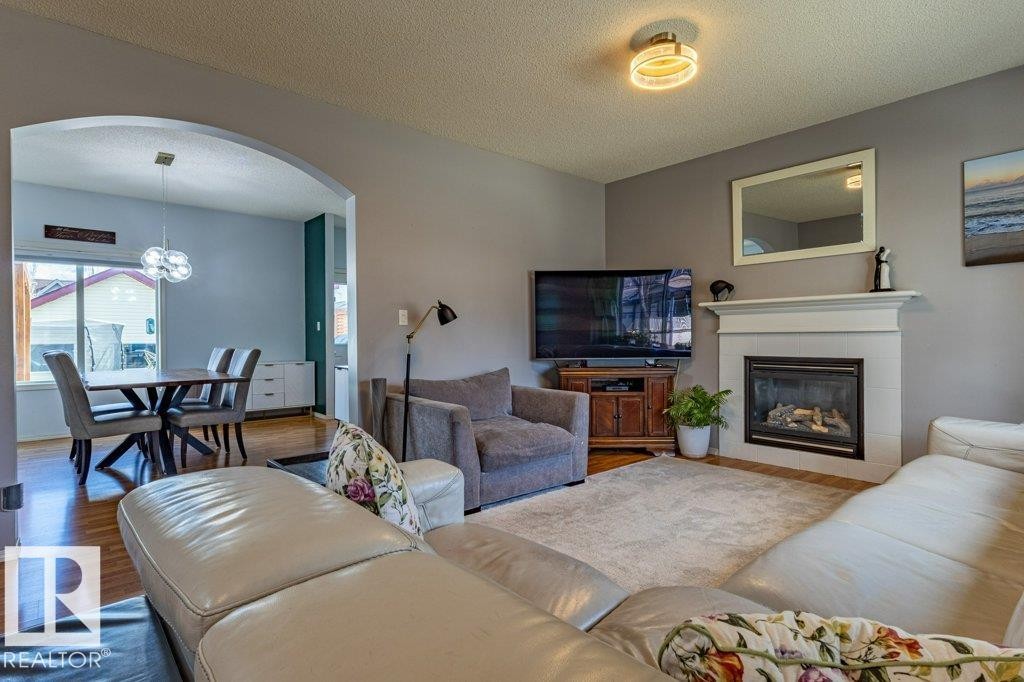 1676 Tomlinson Common, Edmonton, AB - Indoor Photo Showing Living Room With Fireplace