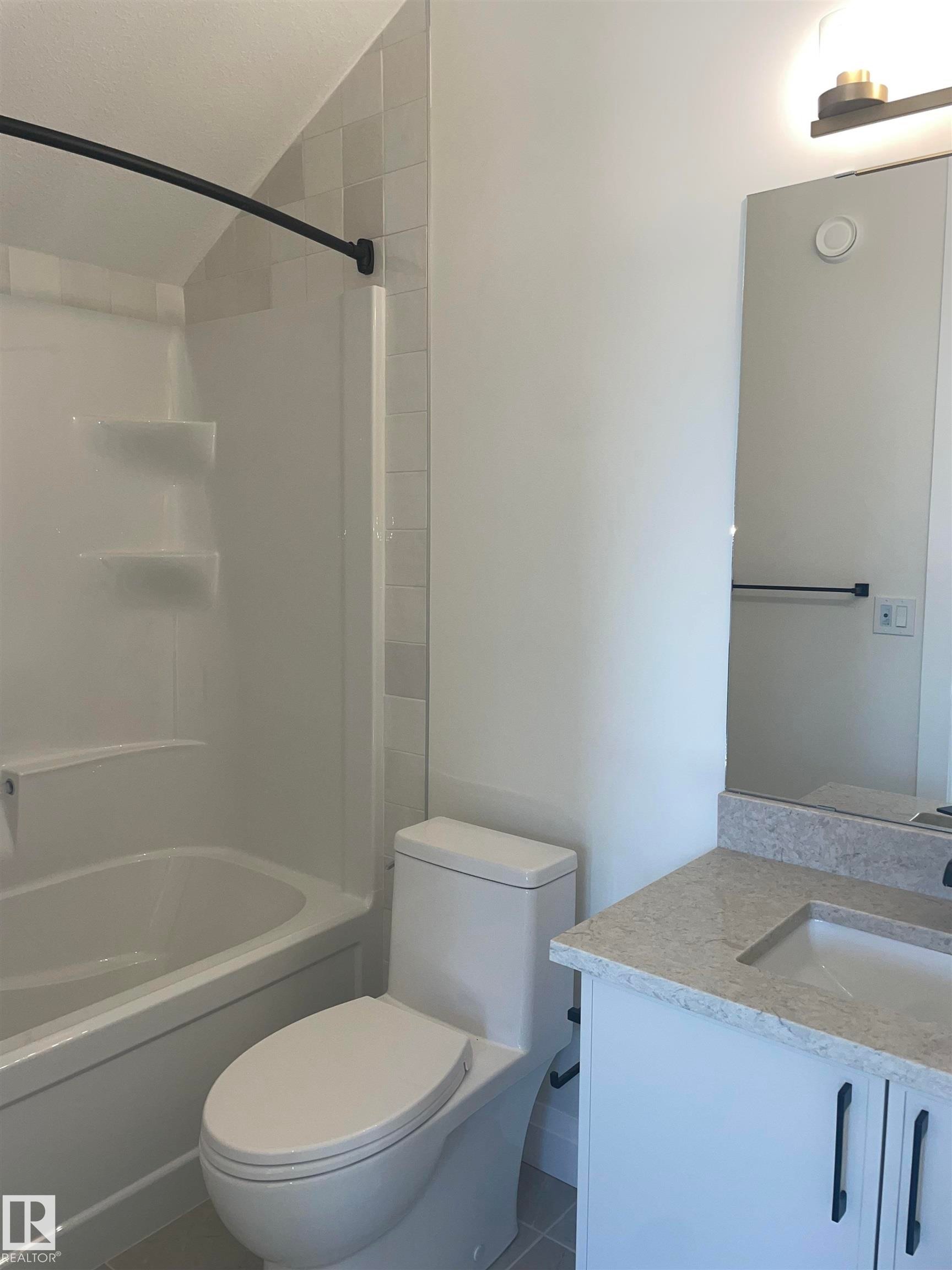 Large picture window with white trim, wood-finish flooring, light-colored walls, and white baseboards - 14344 92A Avenue, Edmonton, AB - Indoor Photo Showing Other Room