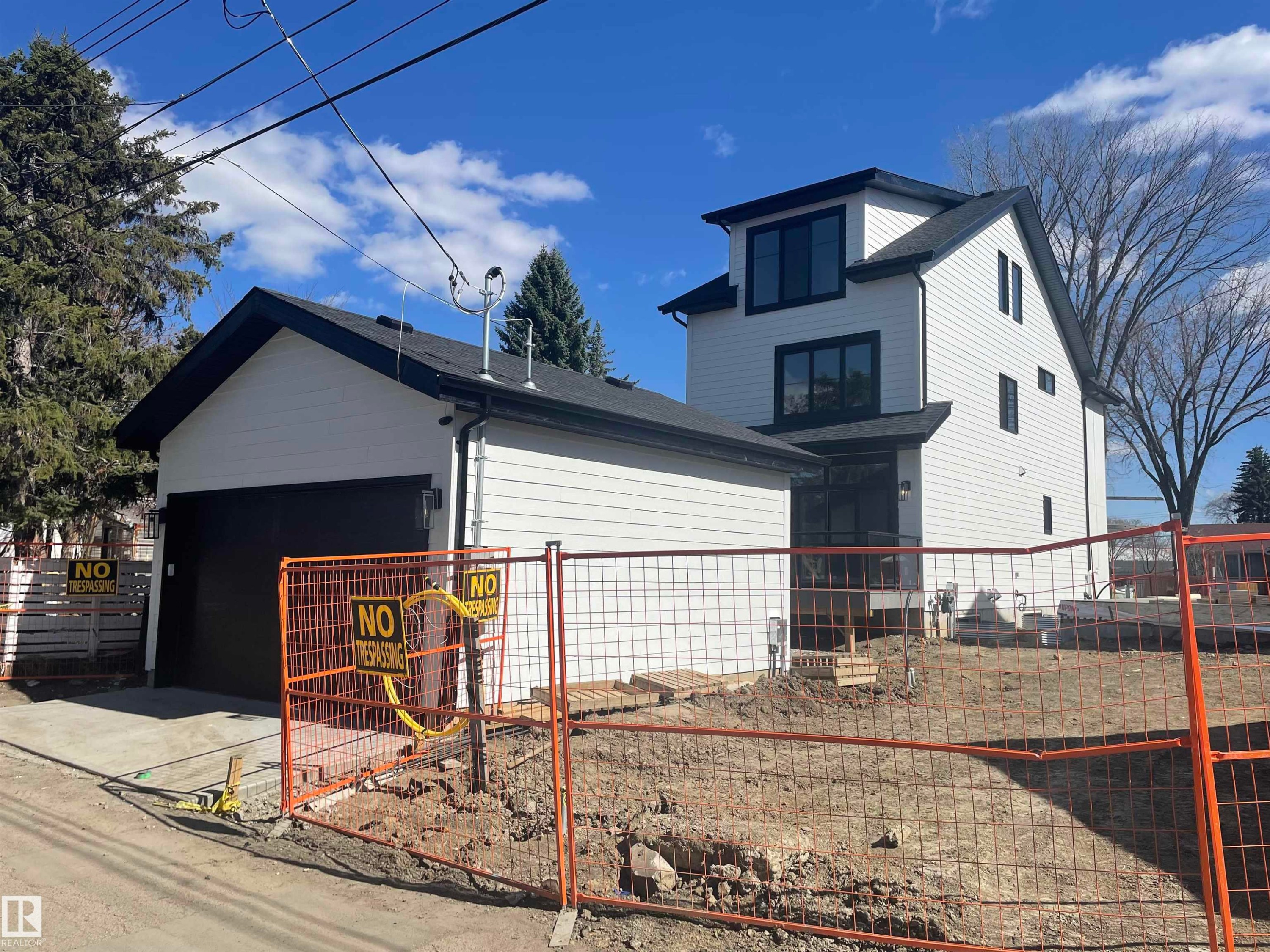 Newly constructed residence featuring white horizontal siding and a dark roof - 14344 92A Avenue, Edmonton, AB - Outdoor With Exterior