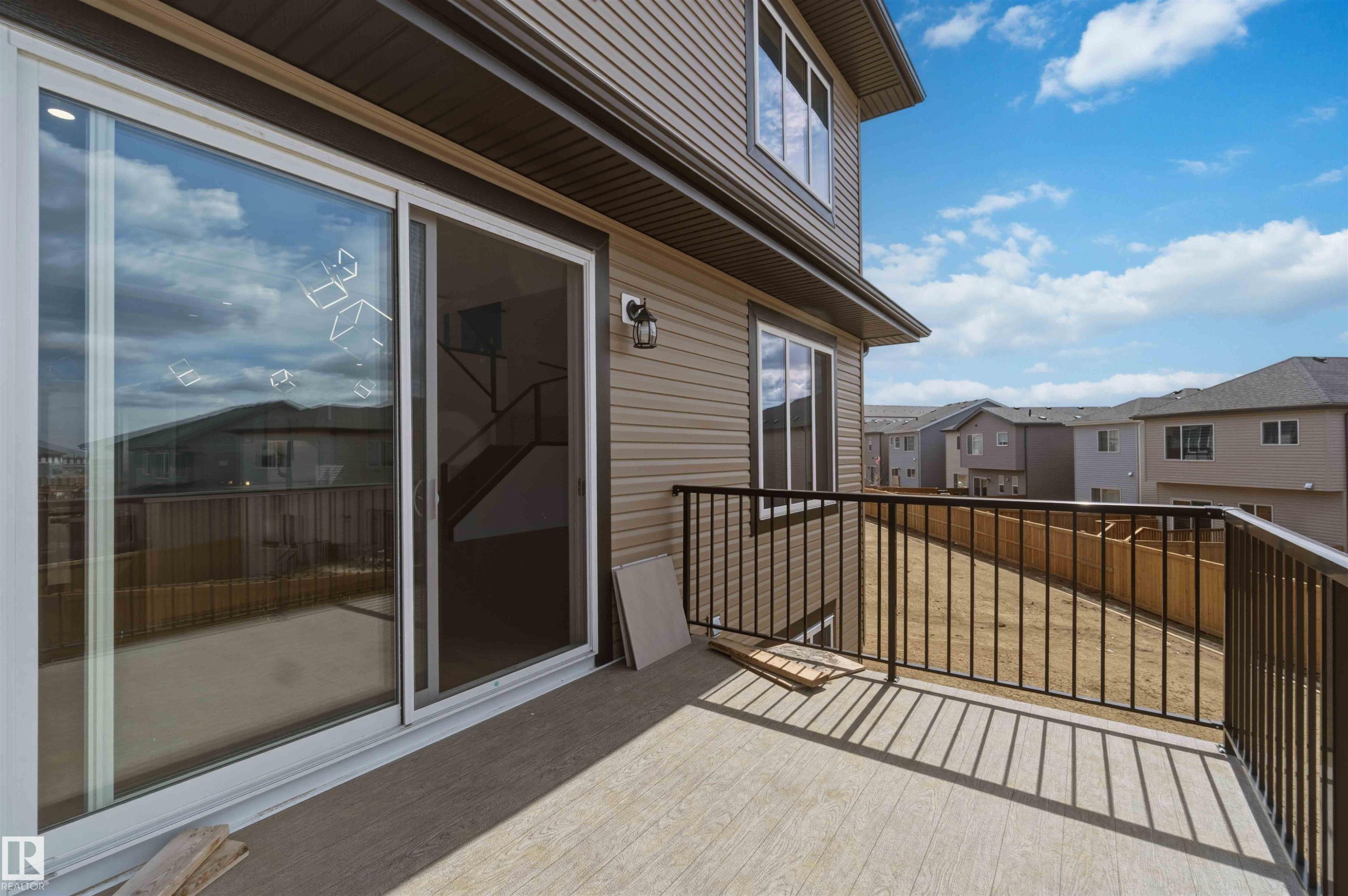 Exterior balcony featuring a concrete surface and black metal railings - 417 Pine Point(E), Leduc, AB - Outdoor With Exterior