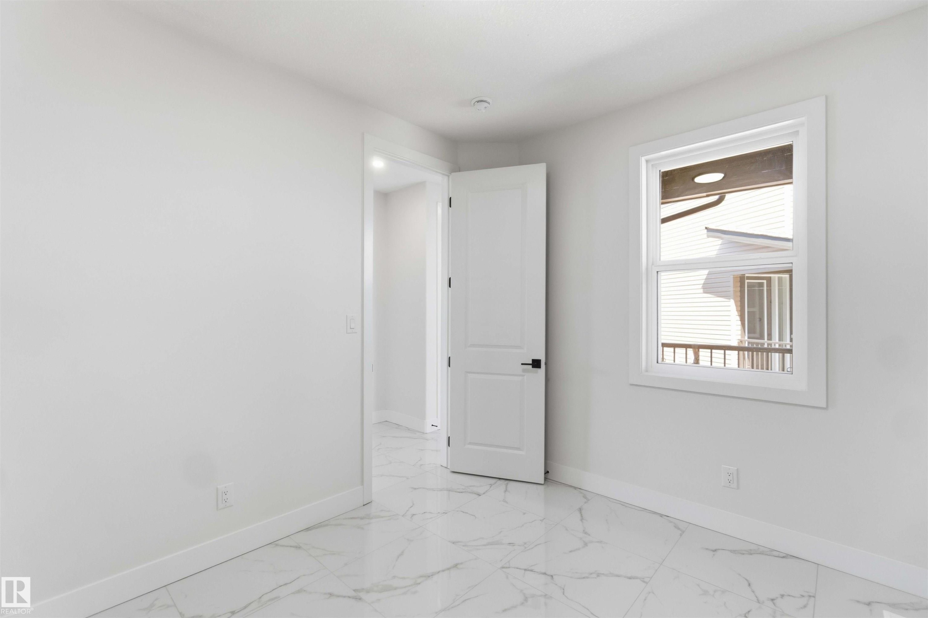 Room featuring white walls and white baseboards - 415 Pine Point(E), Leduc, AB - Indoor Photo Showing Other Room