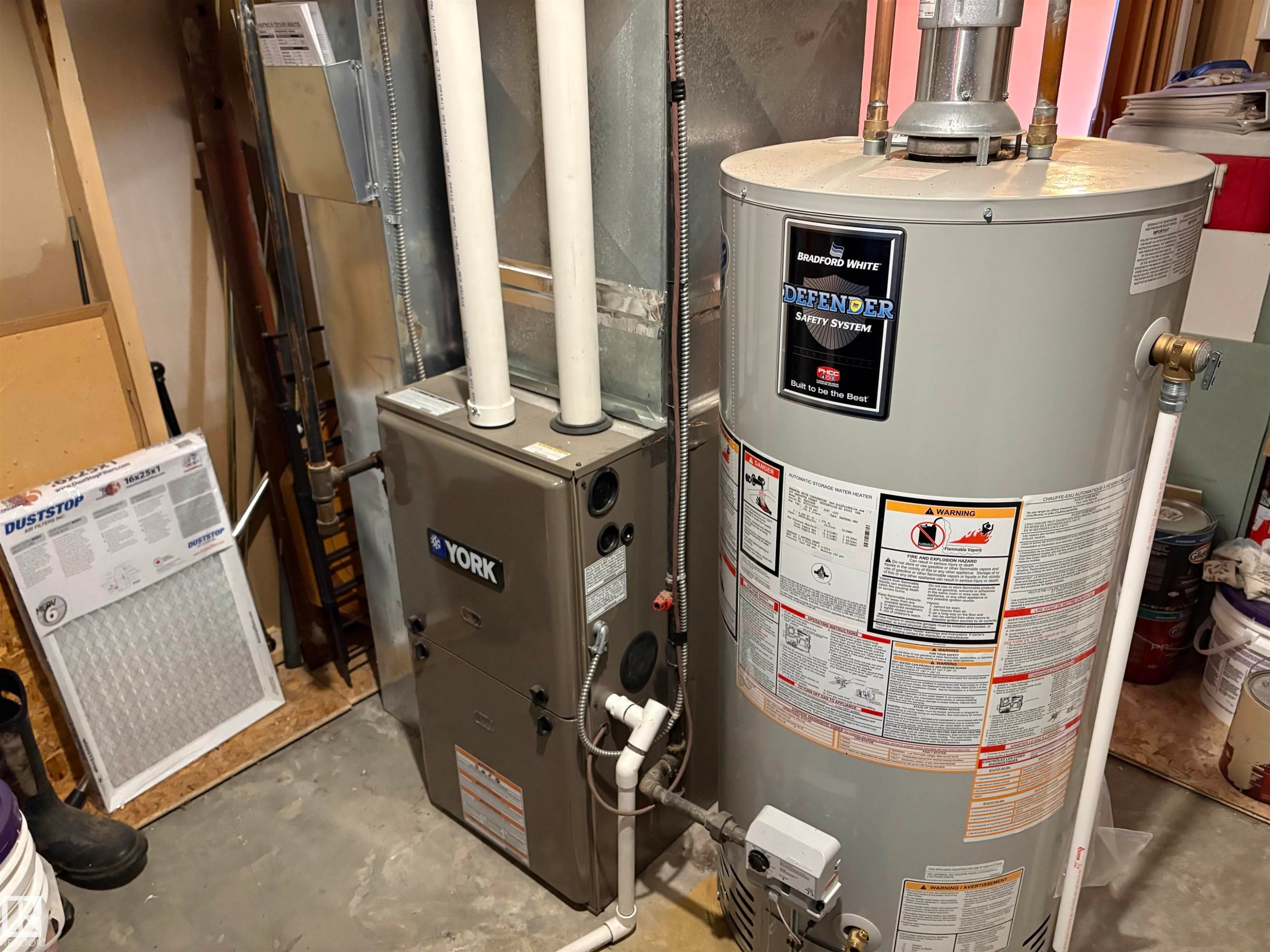 York furnace and Bradford White hot water heater - 410 Main St, Alcomdale, AB - Indoor Photo Showing Basement