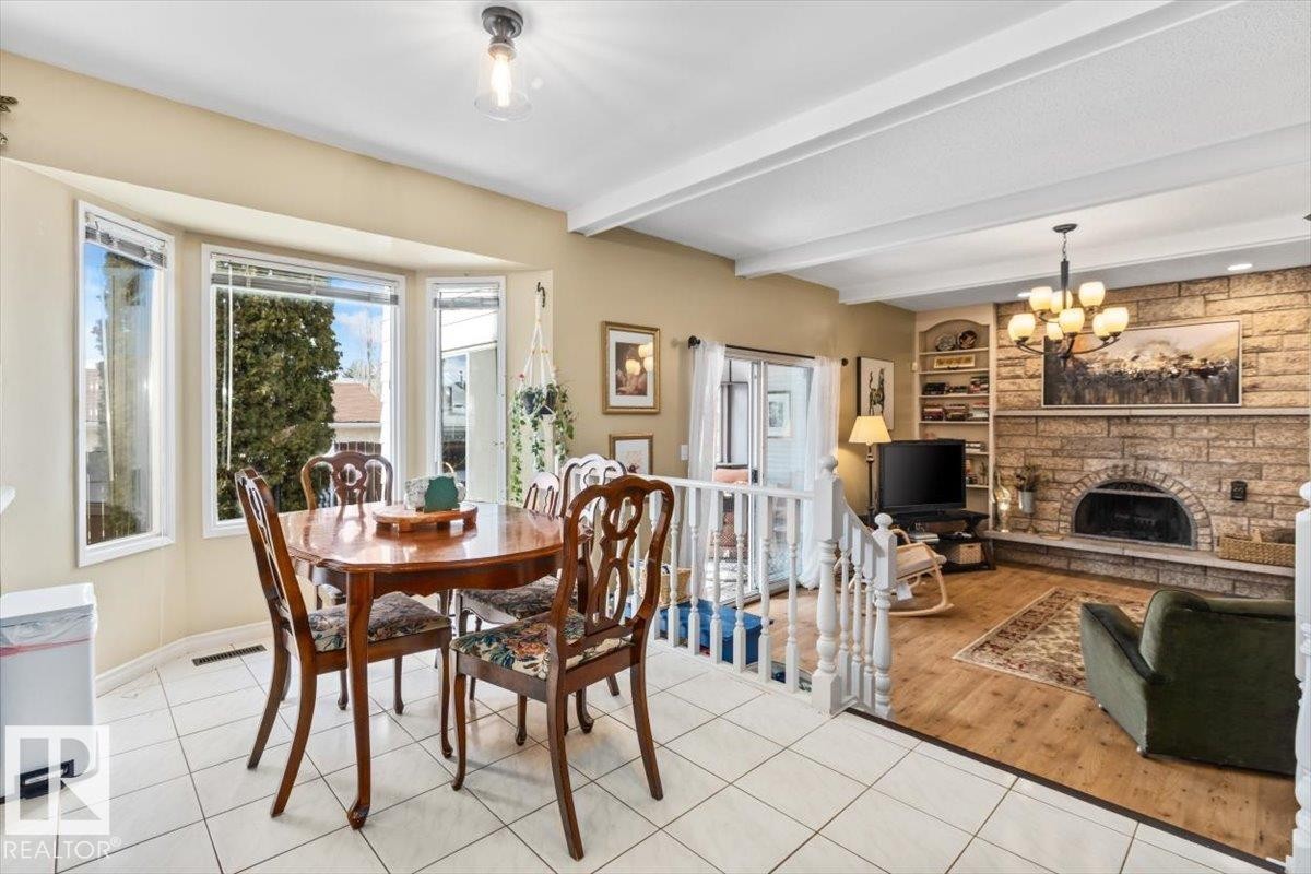 2446 78 Street, Edmonton, AB - Indoor Photo Showing Dining Room With Fireplace