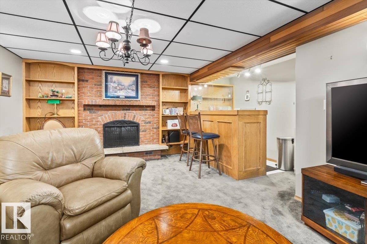 2446 78 Street, Edmonton, AB - Indoor Photo Showing Living Room With Fireplace