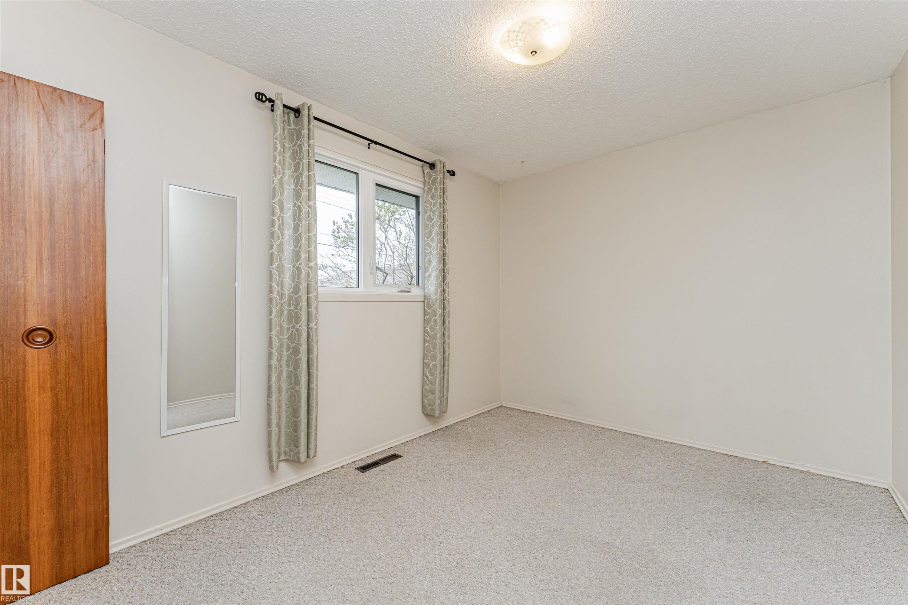Room featuring light-colored carpeting and white walls - 11423 50 Avenue, Edmonton, AB - Indoor Photo Showing Other Room