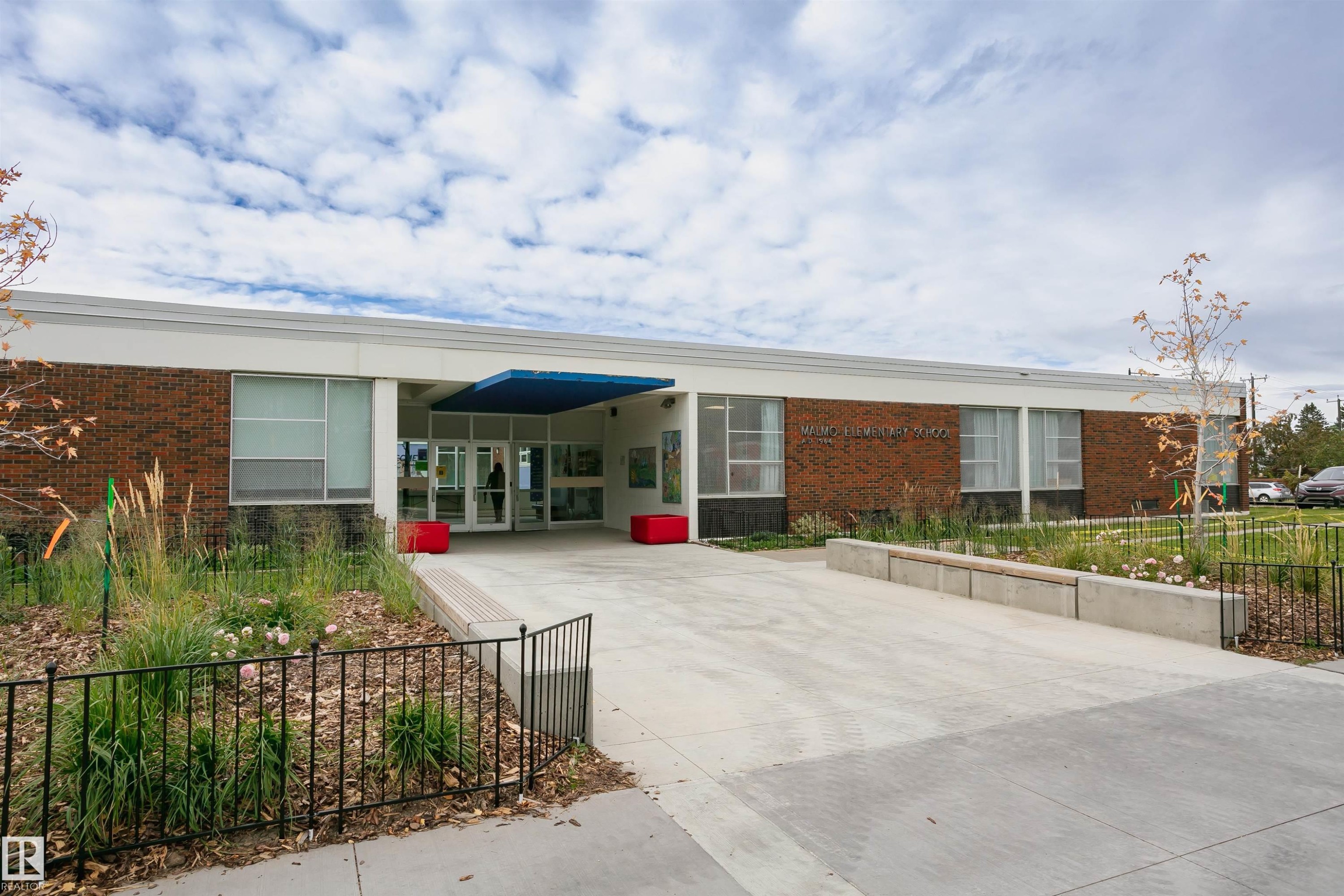 Modern building facade featuring brick and white siding - 11423 50 Avenue, Edmonton, AB - Outdoor