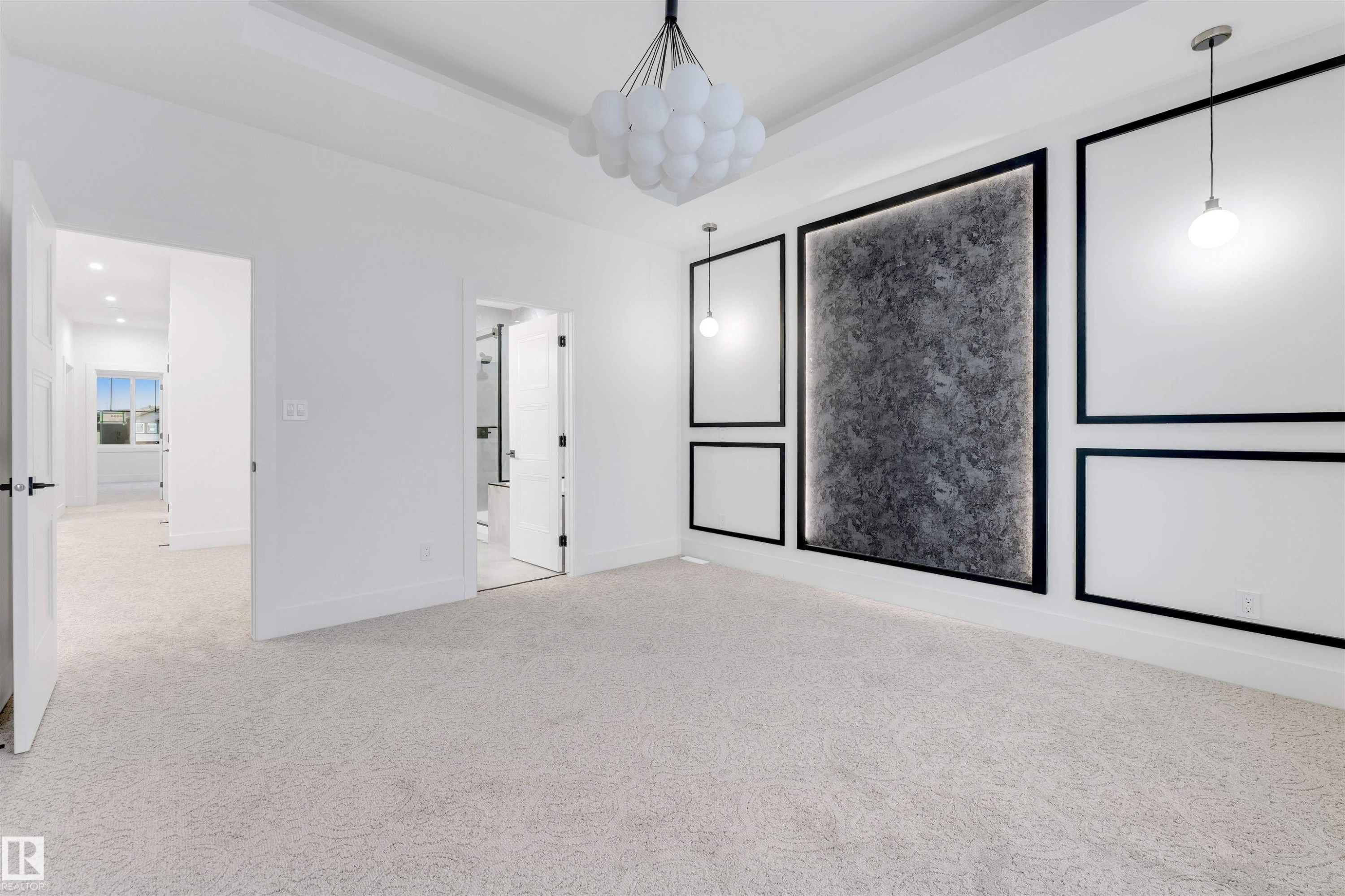 This expansive room features plush carpeting and a modern chandelier - 4004 35 Street, Beaumont, AB - Indoor Photo Showing Other Room