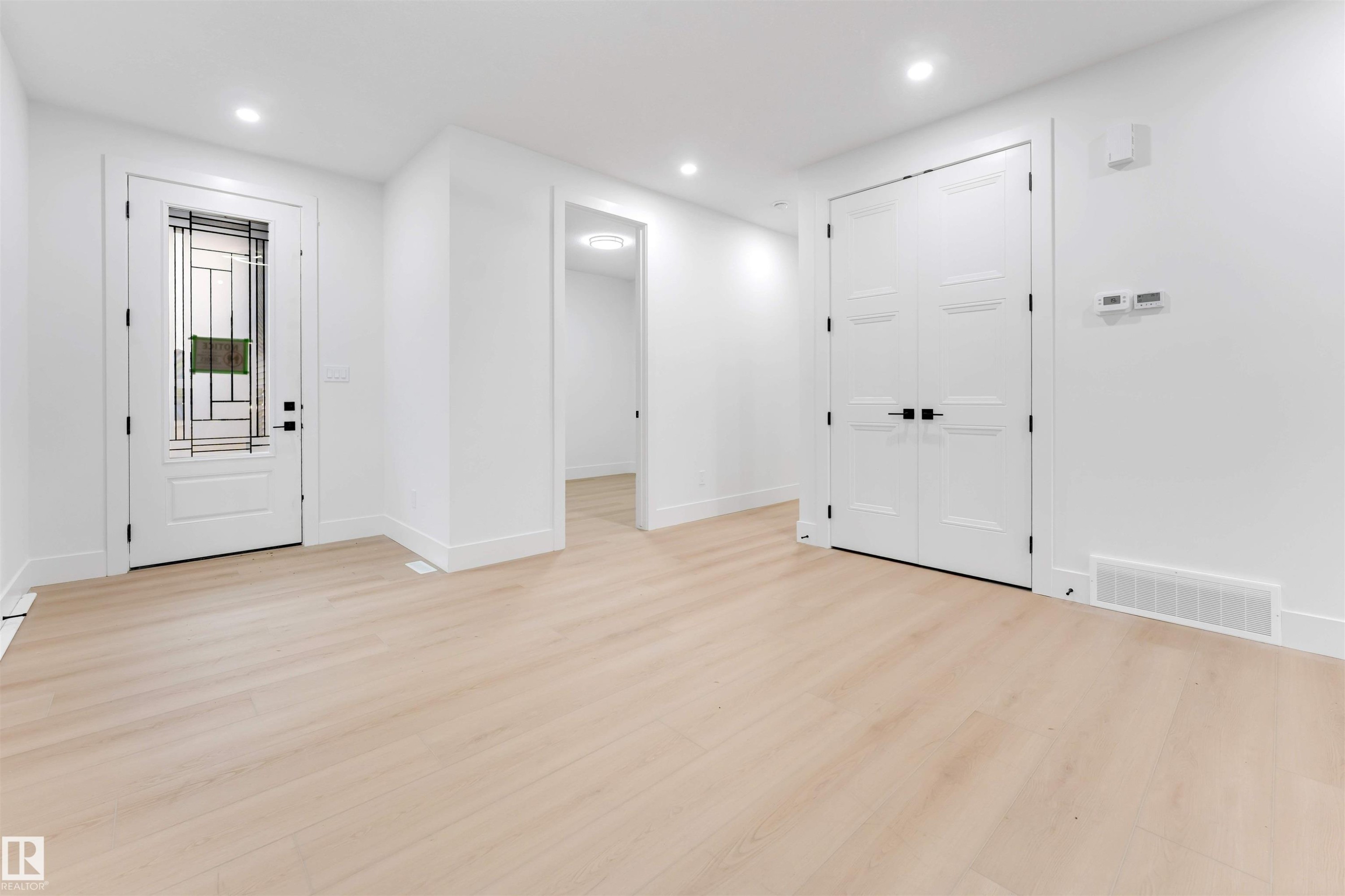 Entryway featuring light-toned flooring, white walls, and recessed lighting - 4004 35 Street, Beaumont, AB - Indoor Photo Showing Other Room