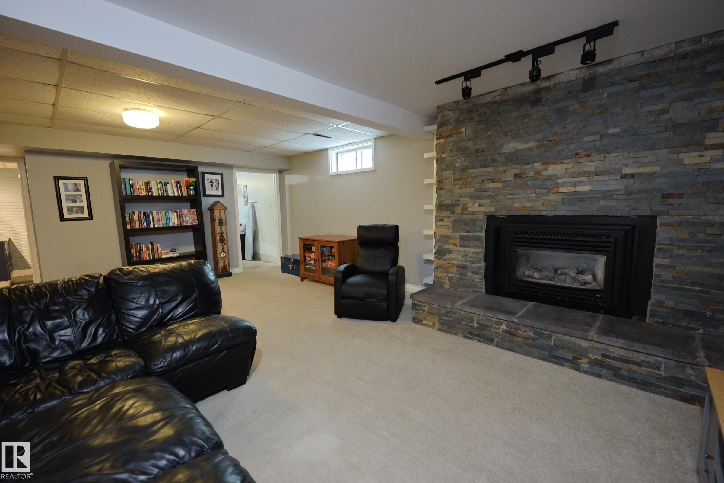 43 Brampton Street, Spruce Grove, AB - Indoor Photo Showing Basement With Fireplace