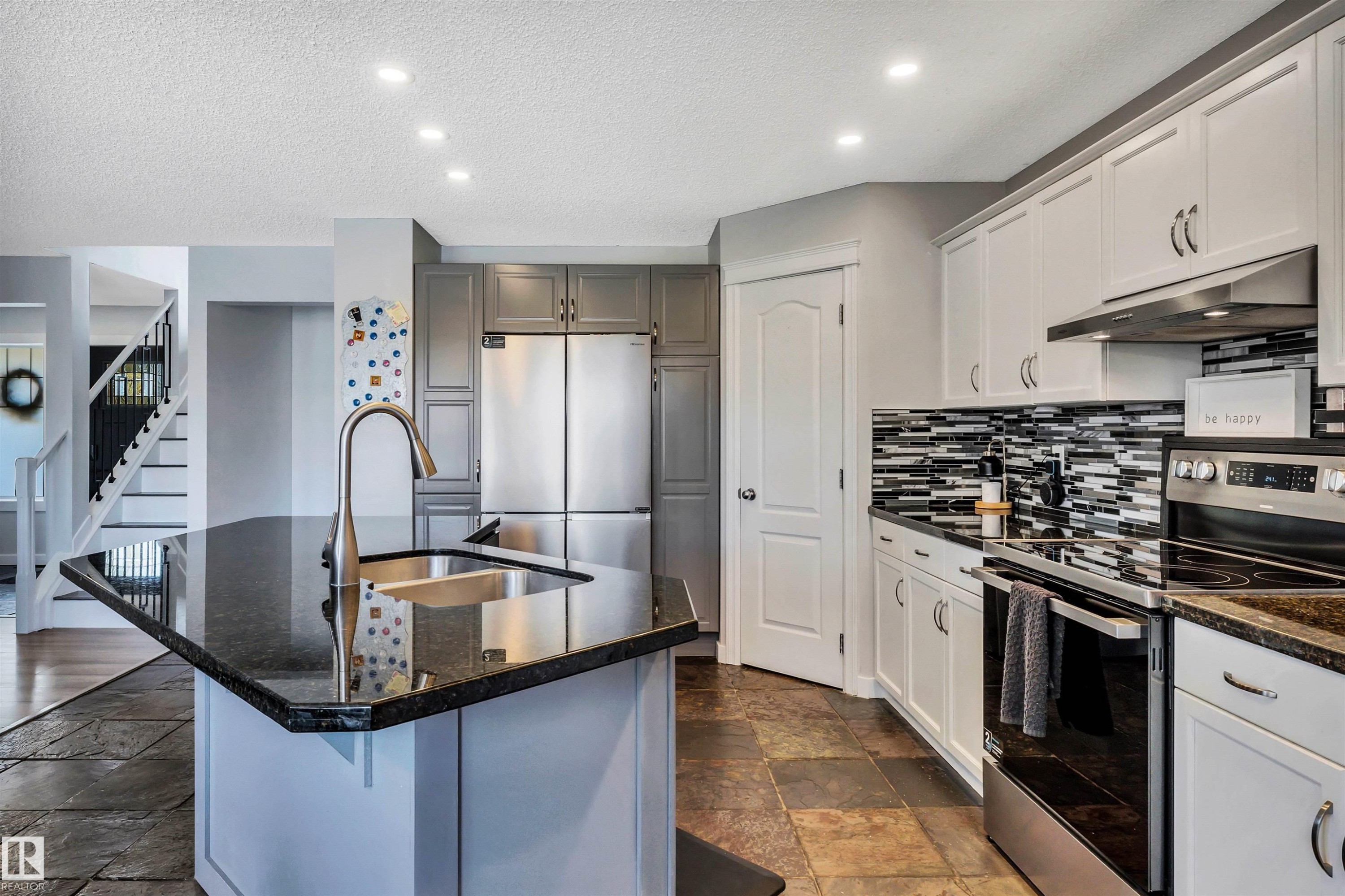 Kitchen featuring granite countertops, stainless steel appliances, a tile backsplash, recessed lighting, and slate tile flooring - 96 Bonin Crescent, Beaumont, AB - Indoor Photo Showing Kitchen With Double Sink With Upgraded Kitchen