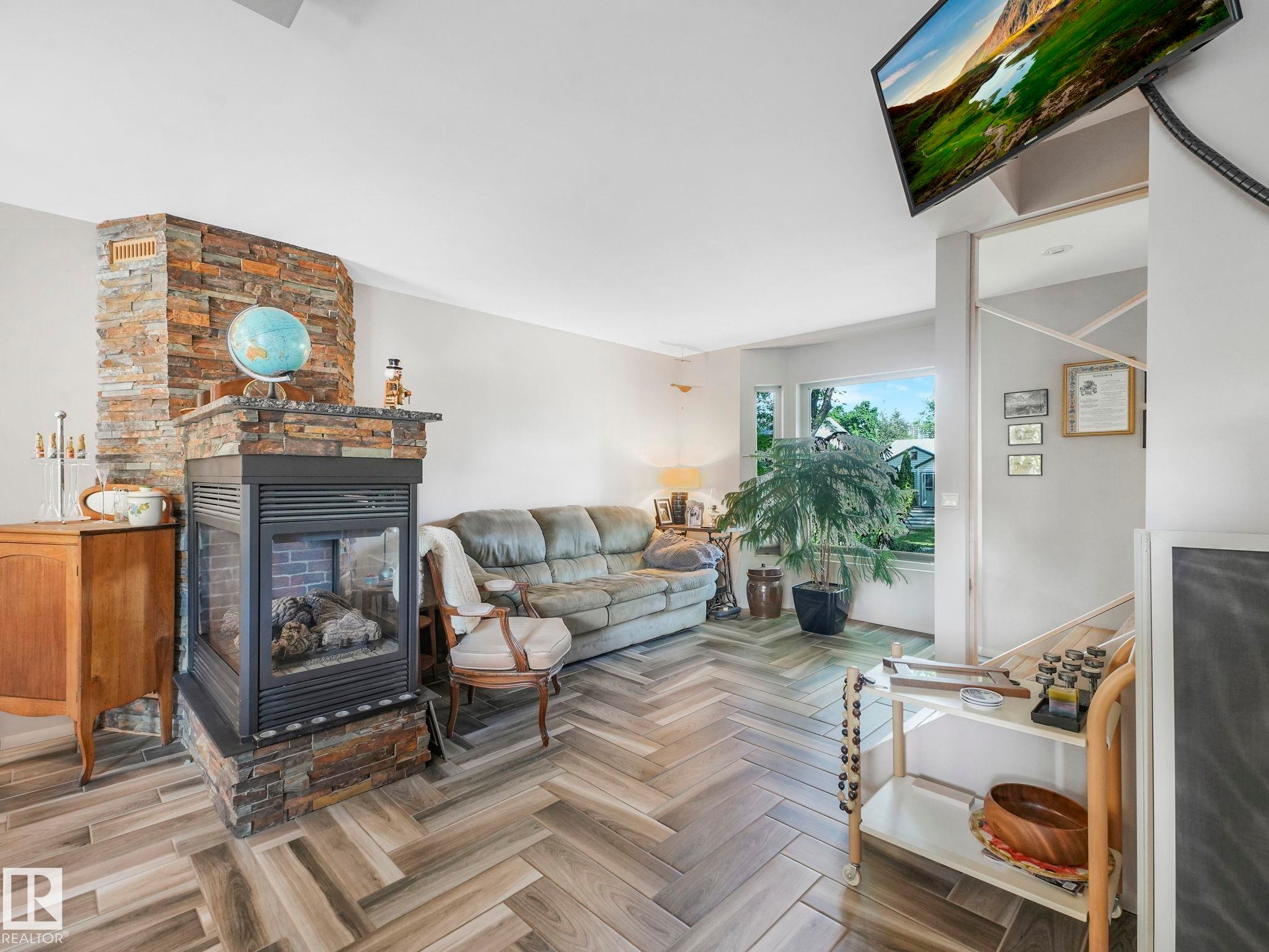 10961 75 Avenue, Edmonton, AB - Indoor Photo Showing Living Room With Fireplace