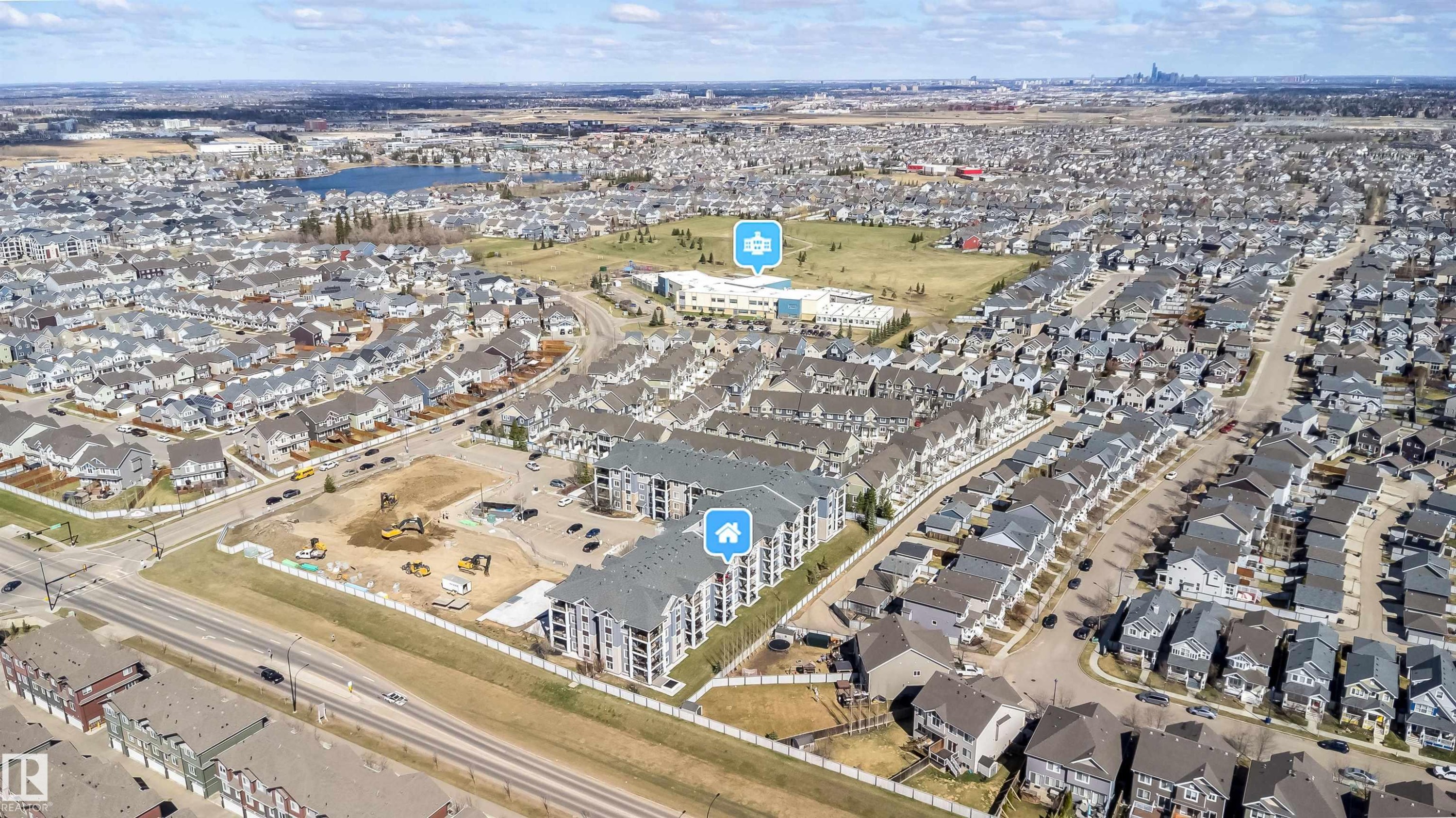 Aerial perspective of a multi-building residential complex, surrounded by established residential neighborhoods - 421 4008 Savaryn Drive, Edmonton, AB - Outdoor With View