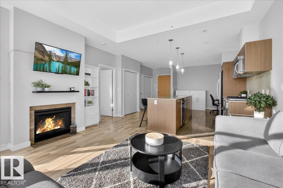 #114 2504 109 St Nw, Edmonton, AB - Indoor Photo Showing Living Room With Fireplace