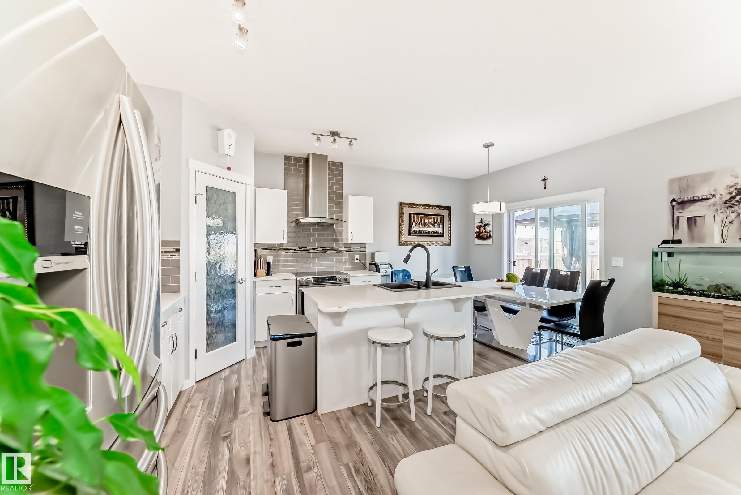 16320 12 Avenue, Edmonton, AB - Indoor Photo Showing Kitchen With Fireplace With Double Sink