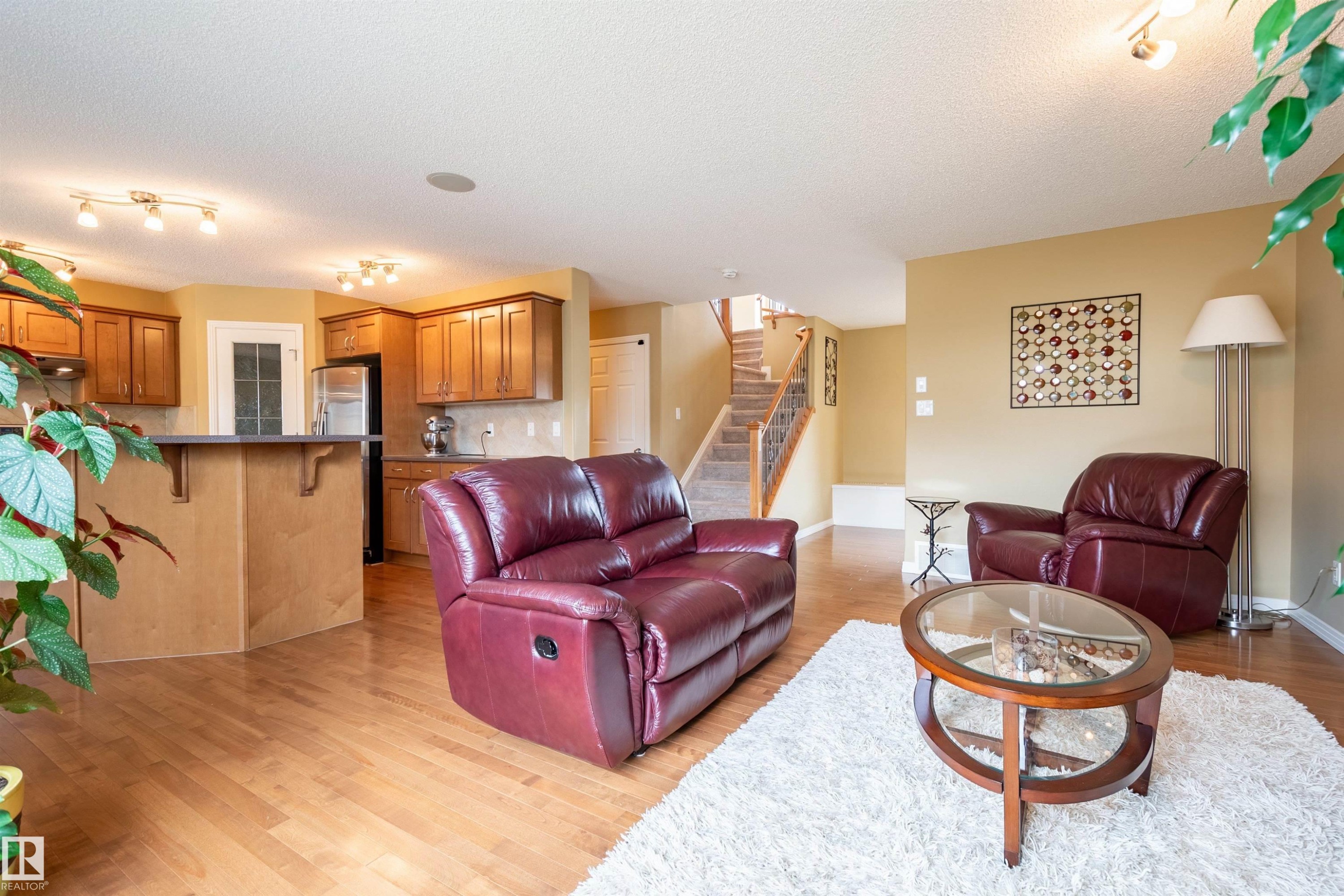 Open concept living area with wood-finish flooring - 2340 Hagen Link, Edmonton, AB - Indoor Photo Showing Living Room