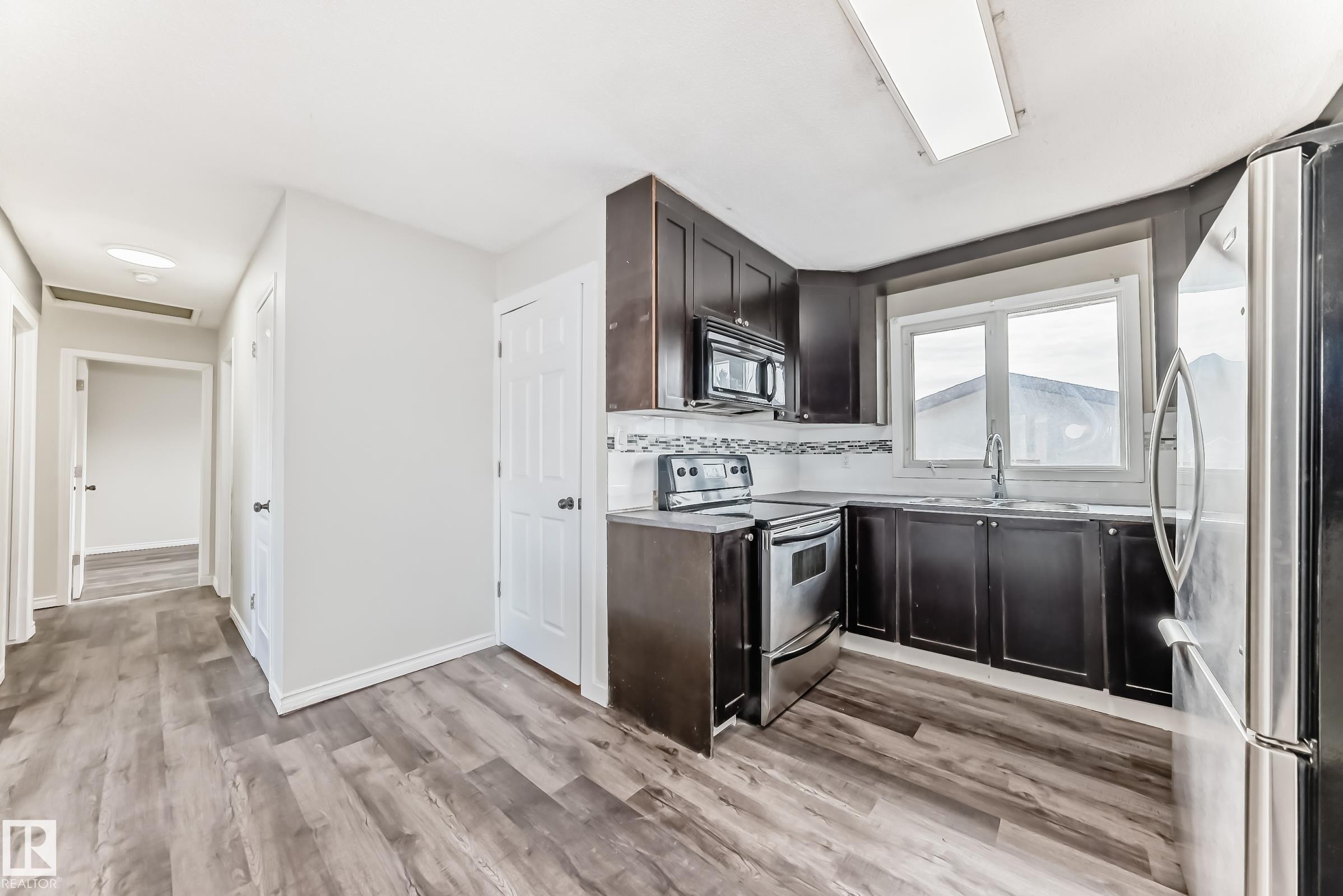 8615 42A Avenue, Edmonton, AB - Indoor Photo Showing Kitchen With Double Sink