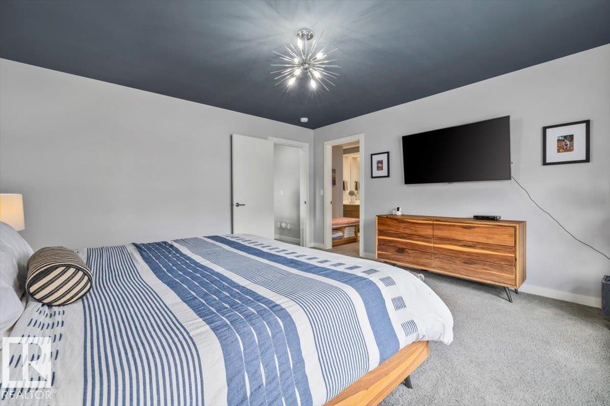 Bedroom featuring a dark-toned ceiling, light gray walls, and carpet flooring - 11245 64 Street, Edmonton, AB - Indoor Photo Showing Bedroom