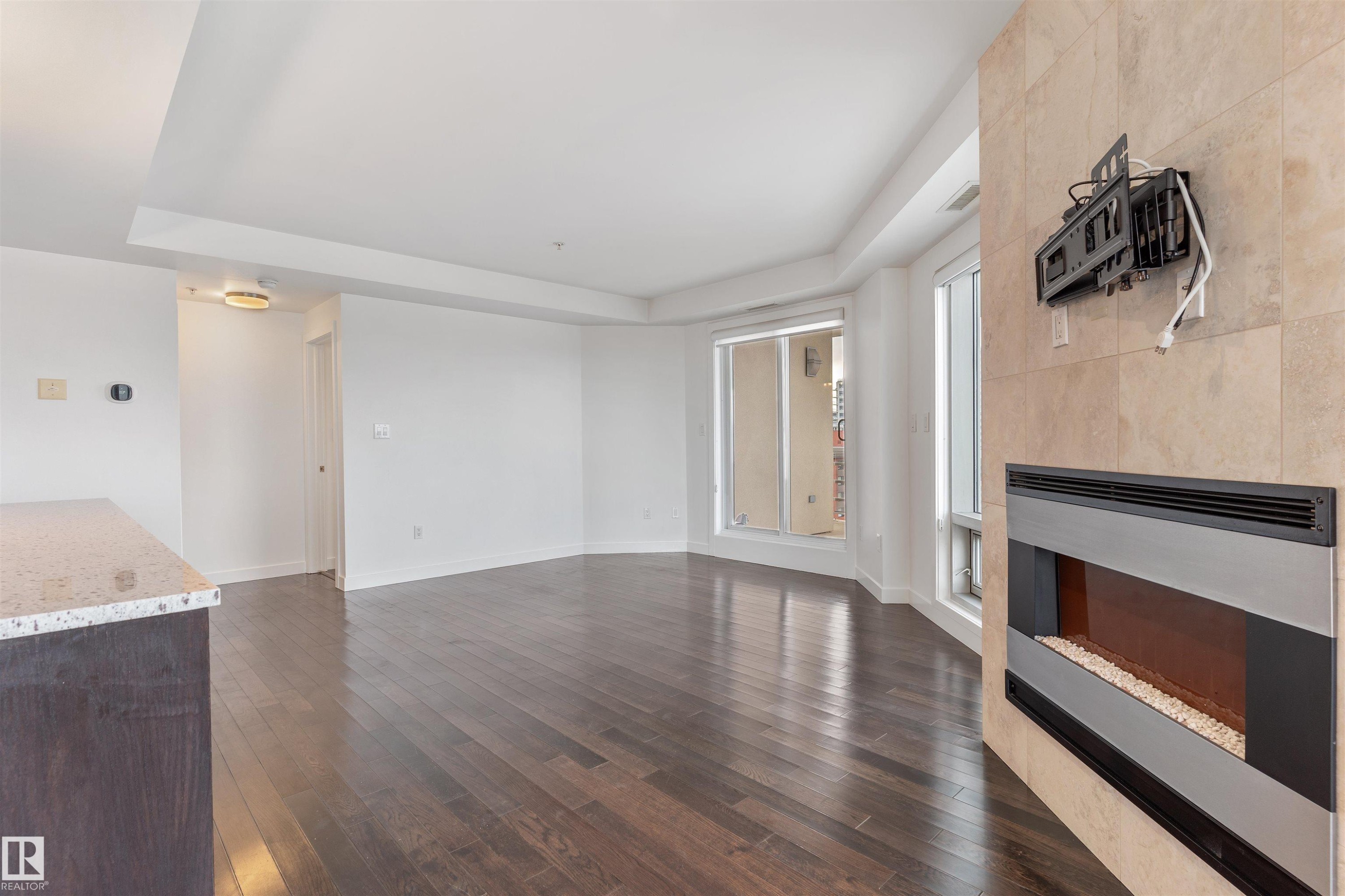 #1901 10388 105 St Nw, Edmonton, AB - Indoor Photo Showing Other Room With Fireplace