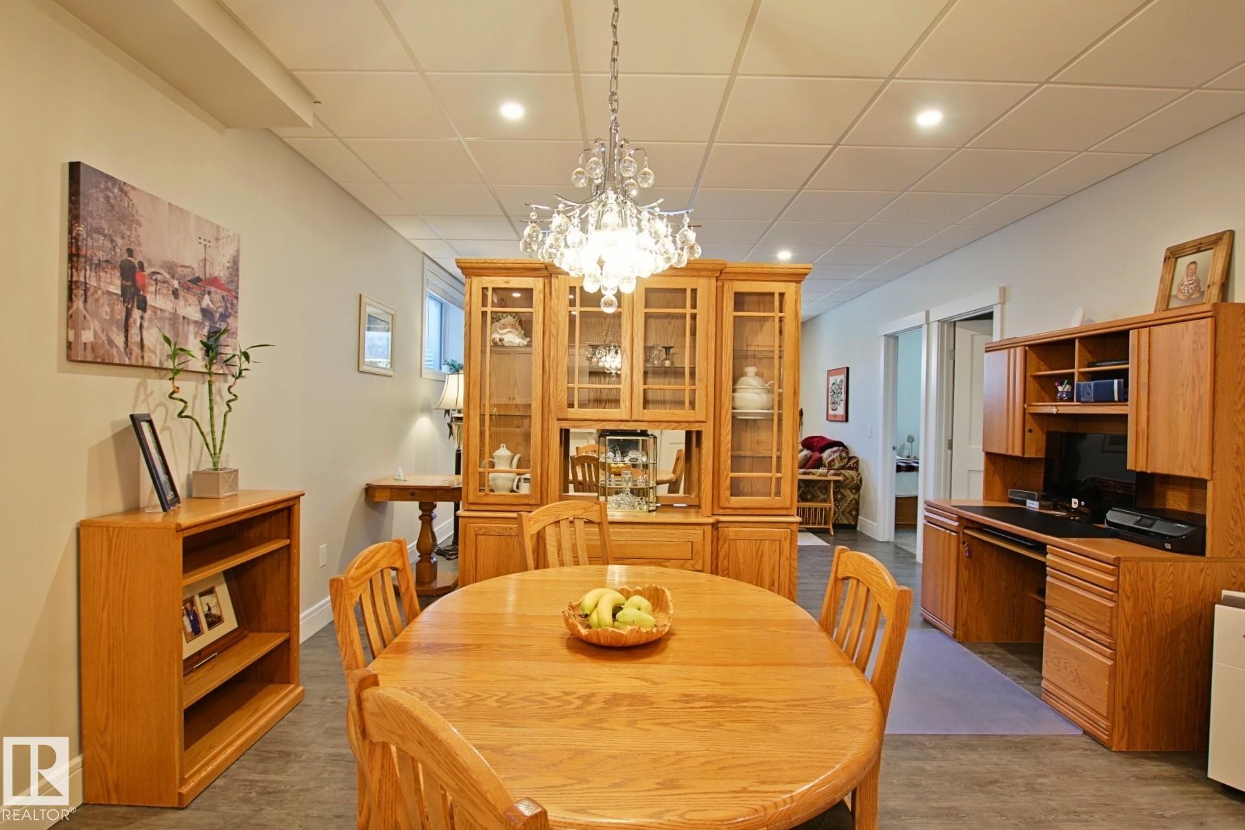 Open-concept room featuring recessed lighting, a decorative chandelier, and light-toned walls - 9711 223 Street, Edmonton, AB