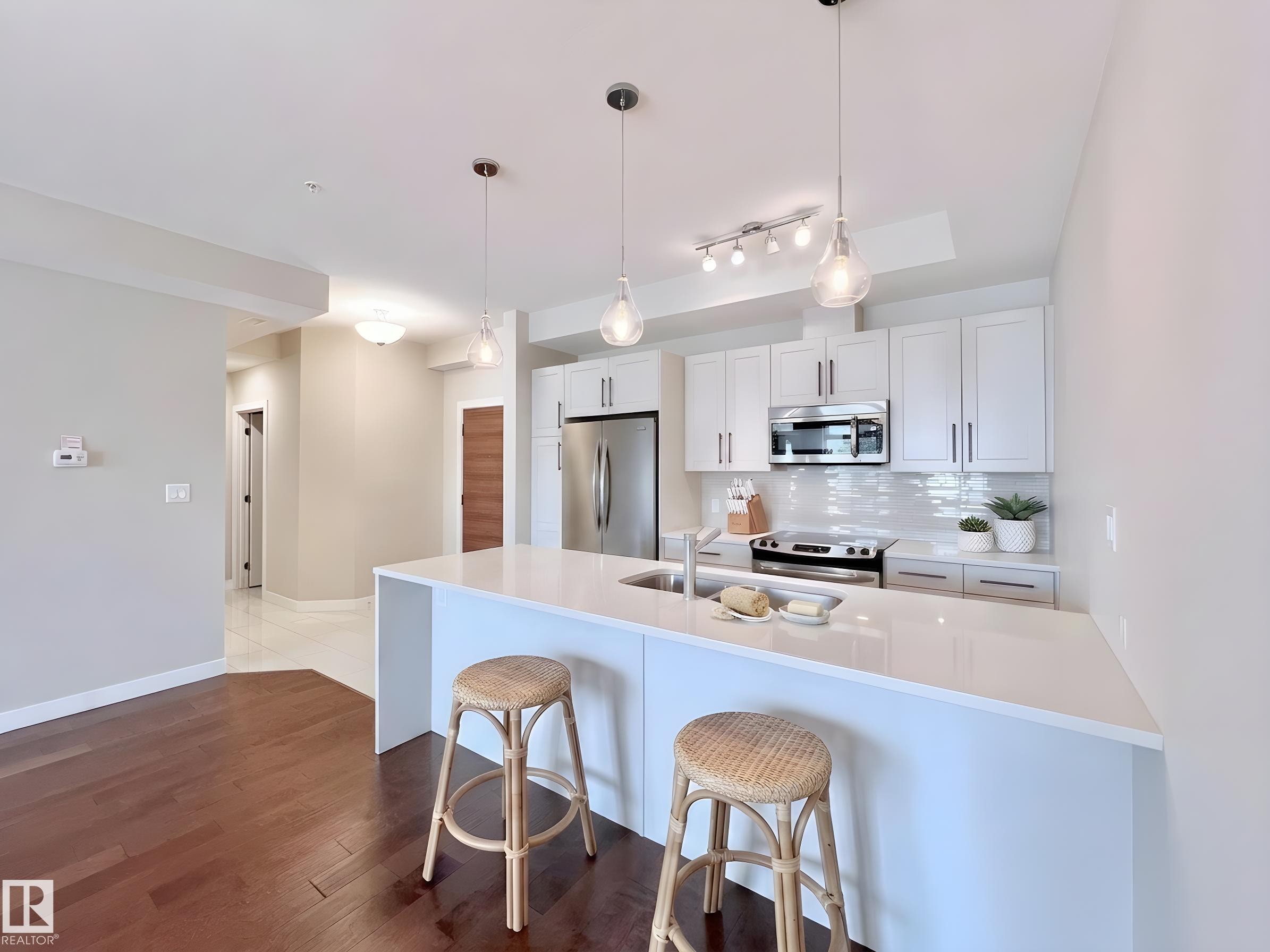 101 625 Leger Way, Edmonton, AB - Indoor Photo Showing Kitchen With Upgraded Kitchen