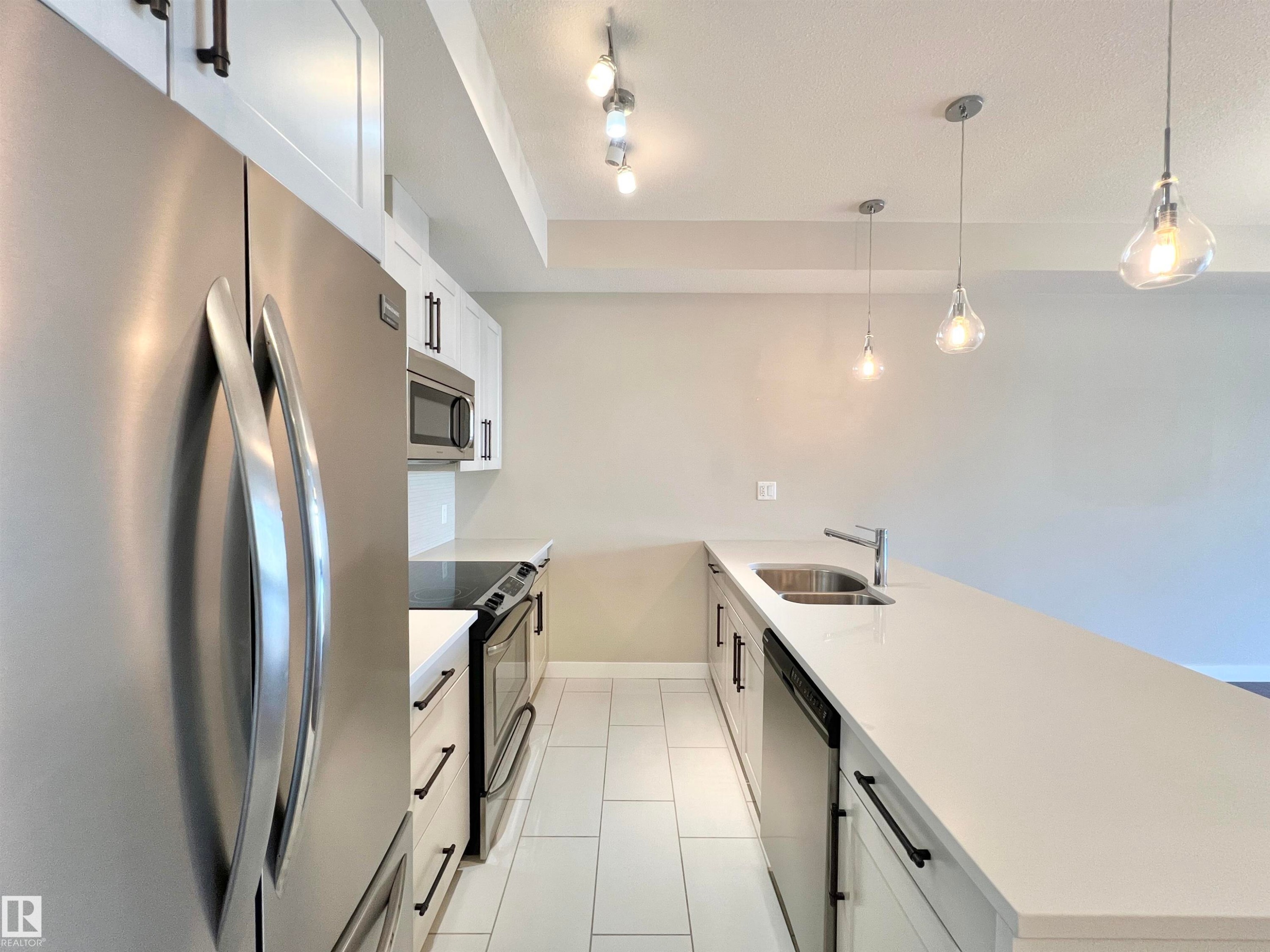 101 625 Leger Way, Edmonton, AB - Indoor Photo Showing Kitchen With Double Sink With Upgraded Kitchen