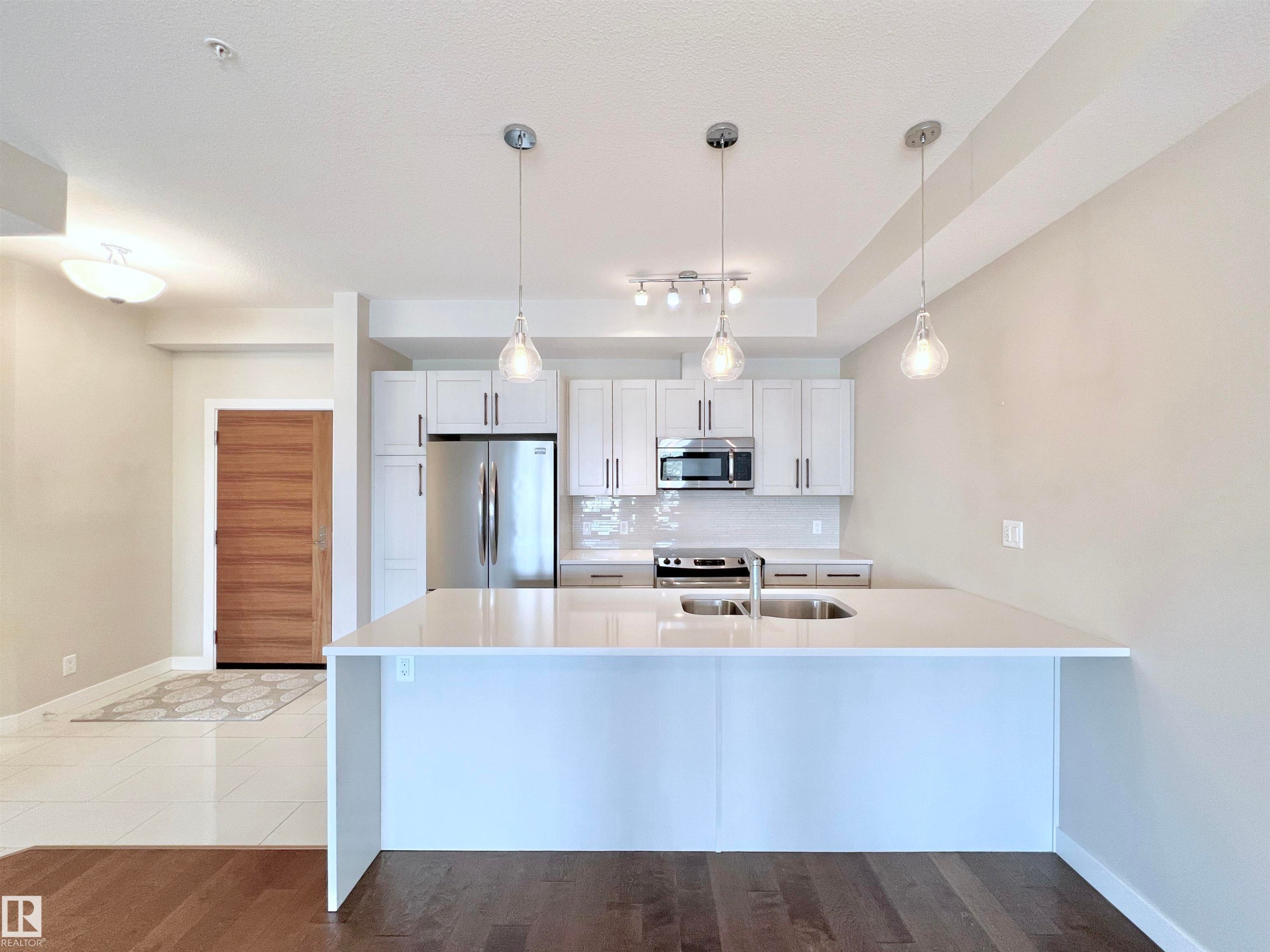 101 625 Leger Way, Edmonton, AB - Indoor Photo Showing Kitchen With Double Sink With Upgraded Kitchen