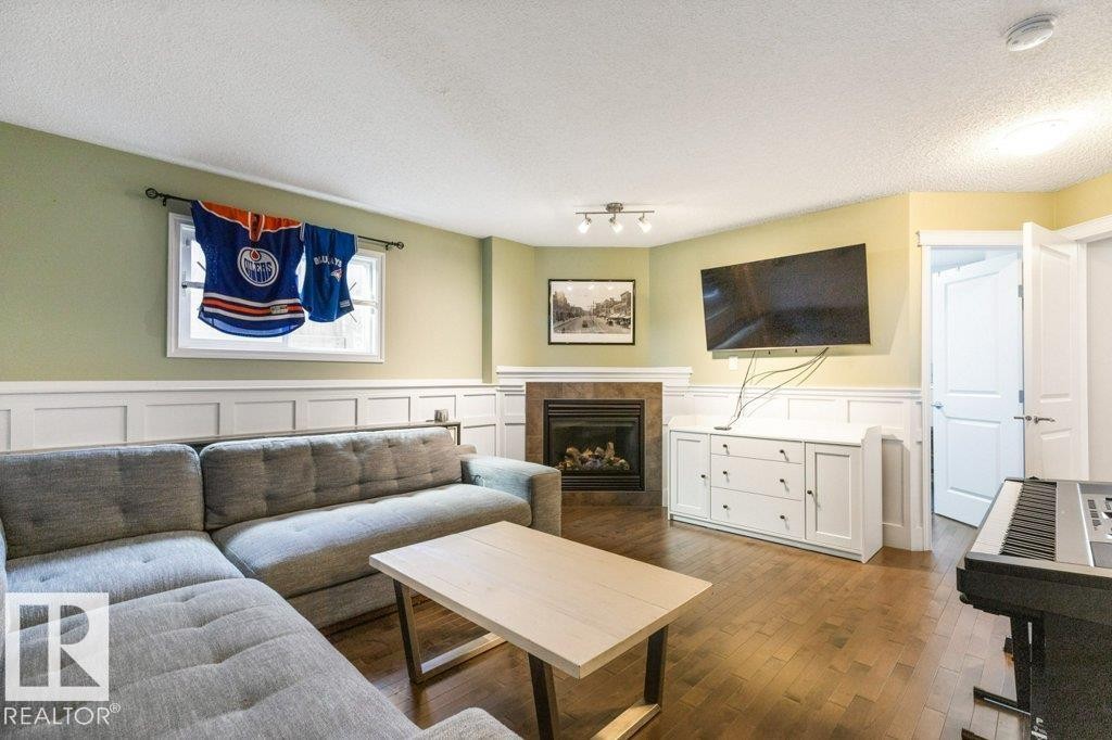 21414 94A Avenue, Edmonton, AB - Indoor Photo Showing Living Room With Fireplace