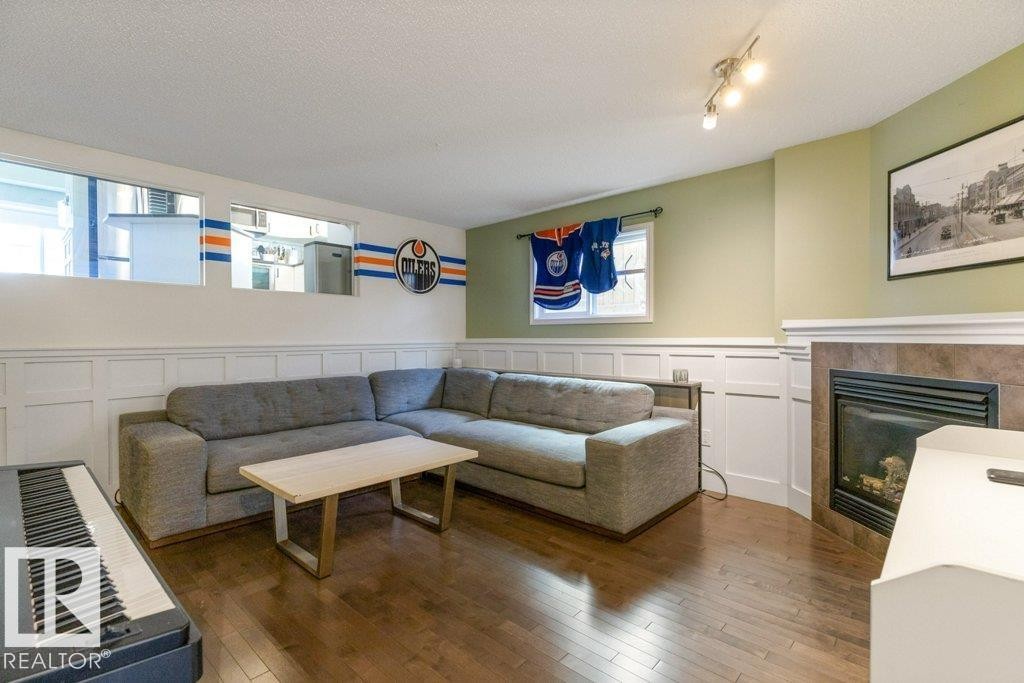 21414 94A Avenue, Edmonton, AB - Indoor Photo Showing Living Room With Fireplace
