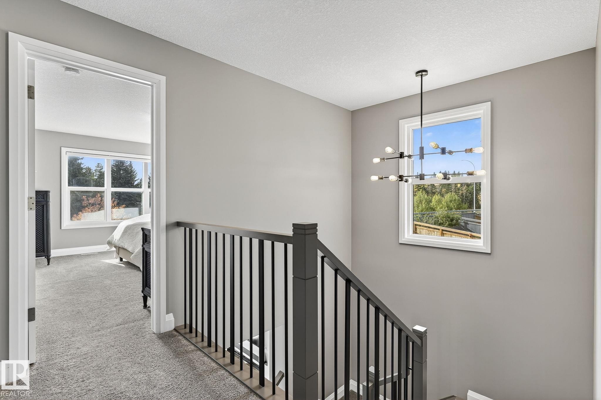 Upper-level landing with gray wall paint and textured white ceiling - 1737 Dumont Crescent, Edmonton, AB - Indoor Photo Showing Other Room