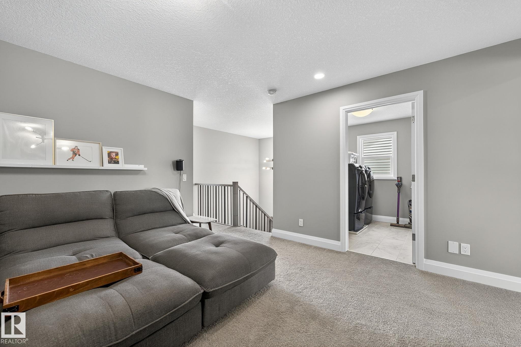 Open concept living area with light gray walls and white trim - 1737 Dumont Crescent, Edmonton, AB - Indoor Photo Showing Living Room
