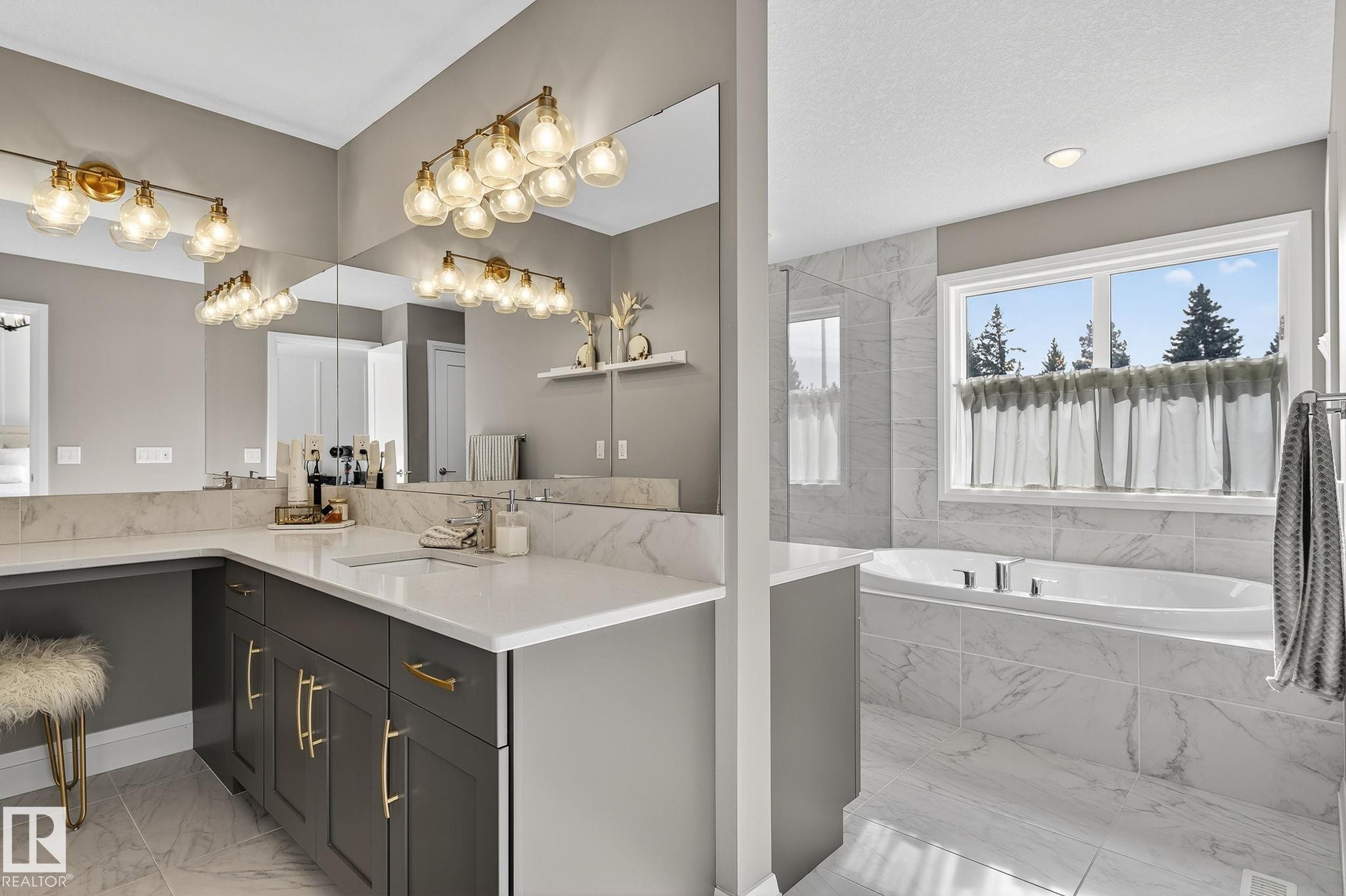 Spacious bathroom featuring an integrated soaking tub, large window, and a vanity with dual sinks - 1737 Dumont Crescent, Edmonton, AB - Indoor Photo Showing Bathroom