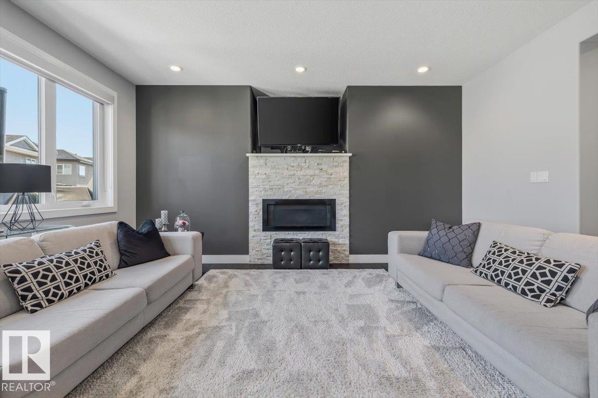 819 Albany Cove, Edmonton, AB - Indoor Photo Showing Living Room With Fireplace