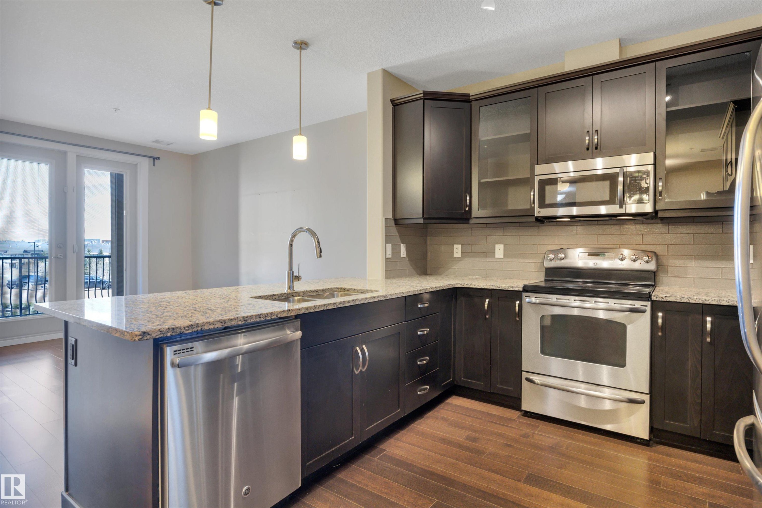 243 6079 Maynard Way, Edmonton, AB - Indoor Photo Showing Kitchen With Upgraded Kitchen