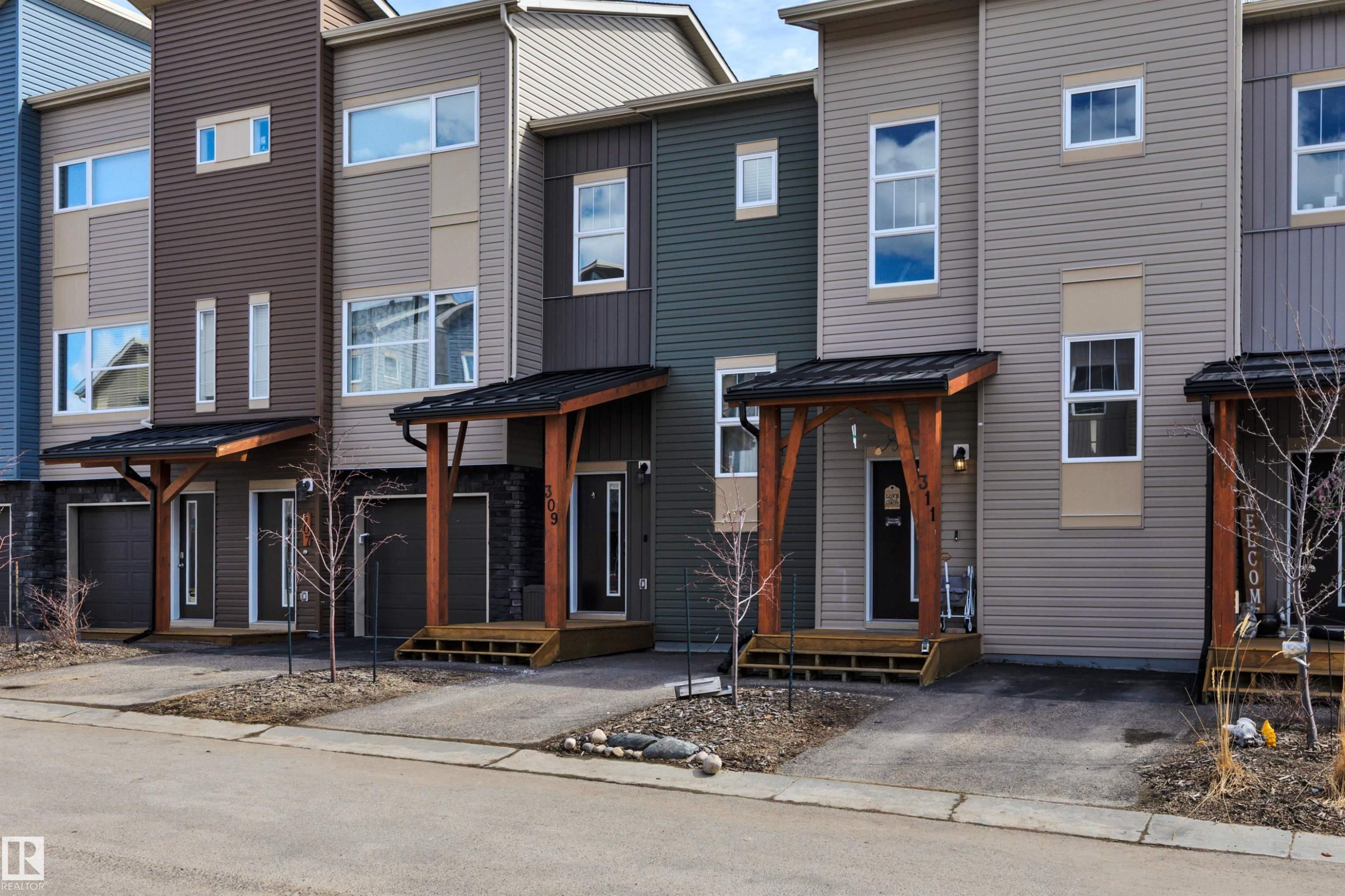 309 401 Southfork Drive, Leduc, AB - Outdoor With Facade