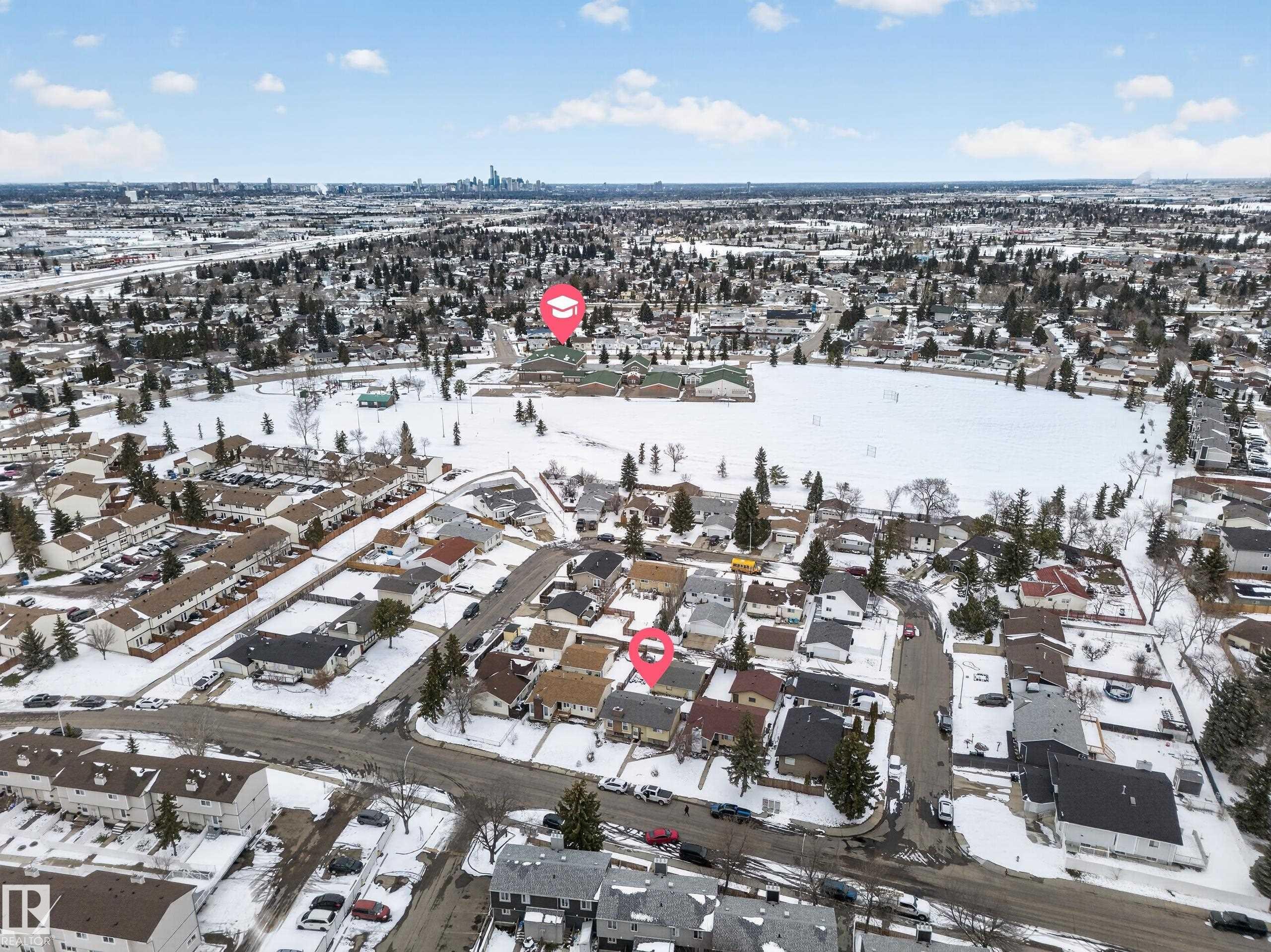 Aerial perspective of a residential neighborhood featuring detached homes and townhouses - 8312 29 Ave Nw, Edmonton, AB - Outdoor With View