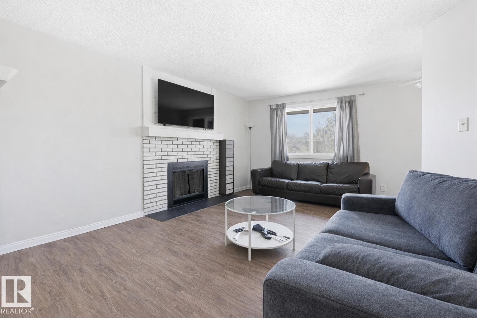 302 6204 180 Street, Edmonton, AB - Indoor Photo Showing Living Room With Fireplace